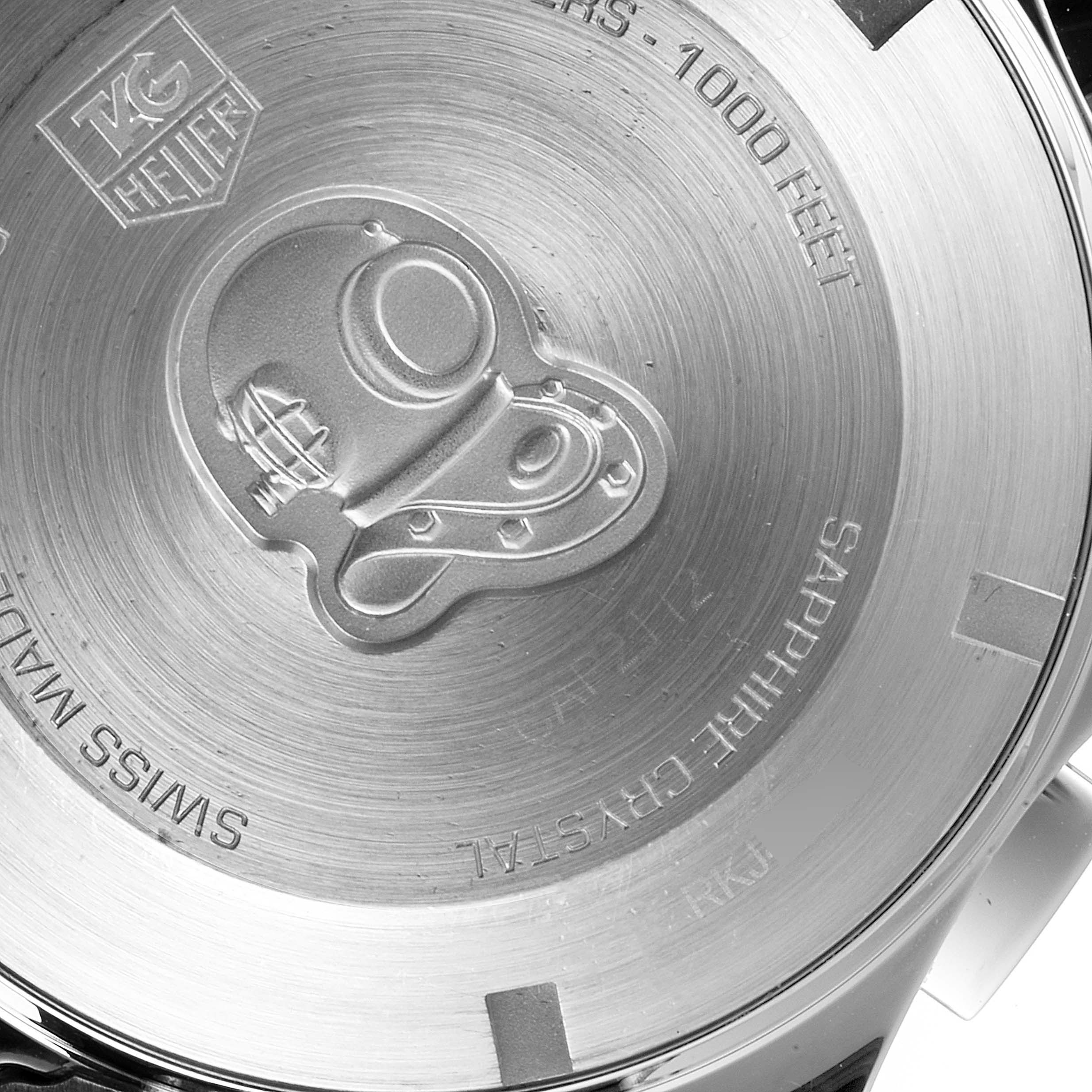 This is a close-up image of the case back of a Tag Heuer Aquaracer CAP2112.BA0833 Men
s Stainless Steel Blue Dial CAP2112.BA0833 Men
s Stainless Steel Blue Dial watch, showing the engraved diving helmet and branding details.