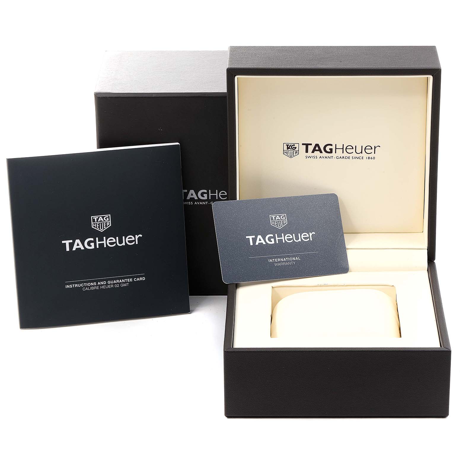 The image shows the open box, warranty card, and user manual for a Carrera model by Tag Heuer.