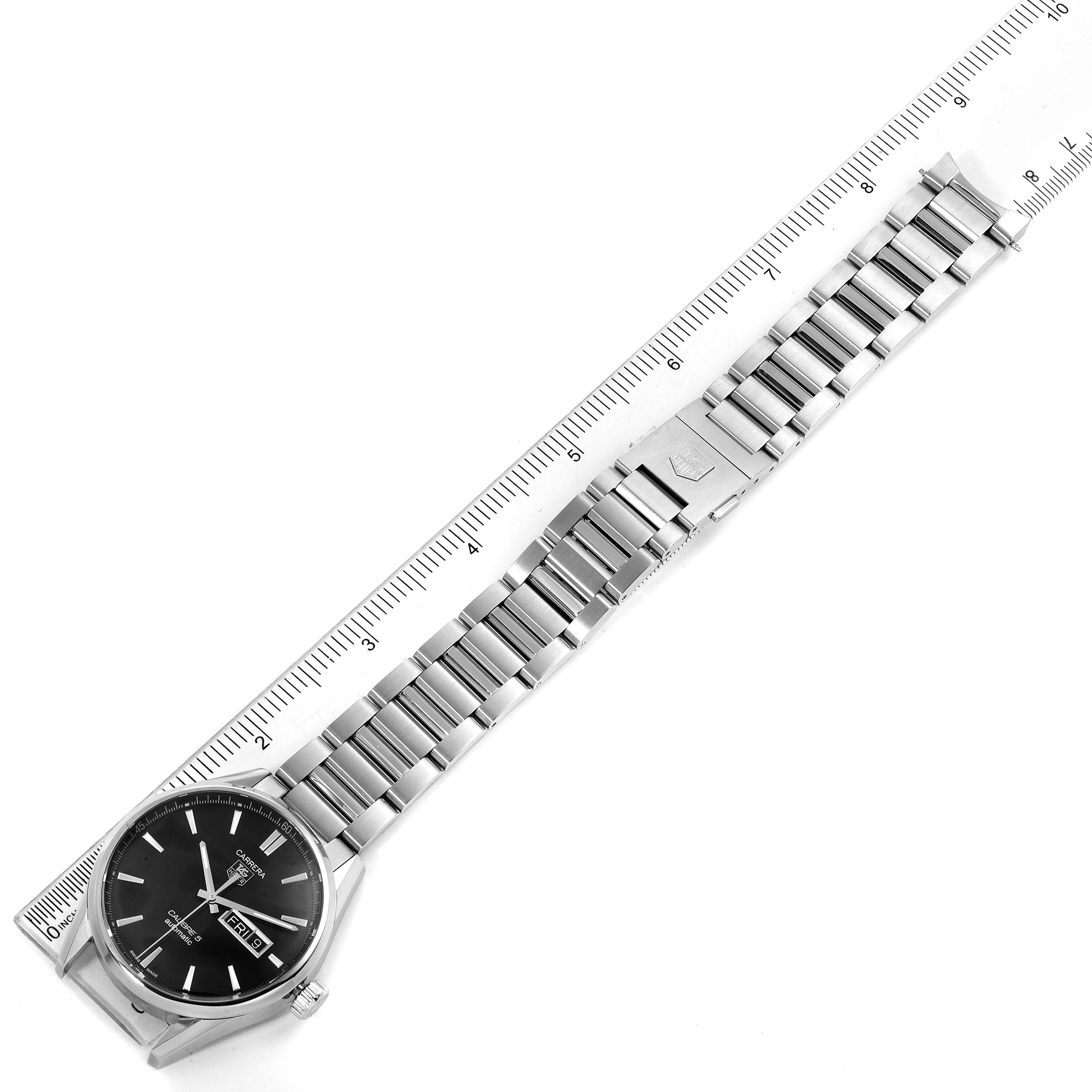 The image shows a top-down view of a Tag Heuer Carrera WAR201A.BA0723 Men's Stainless Steel Black Dial WAR201A.BA0723 Men's Stainless Steel Black Dial watch with a silver metal bracelet and ruler for scale.