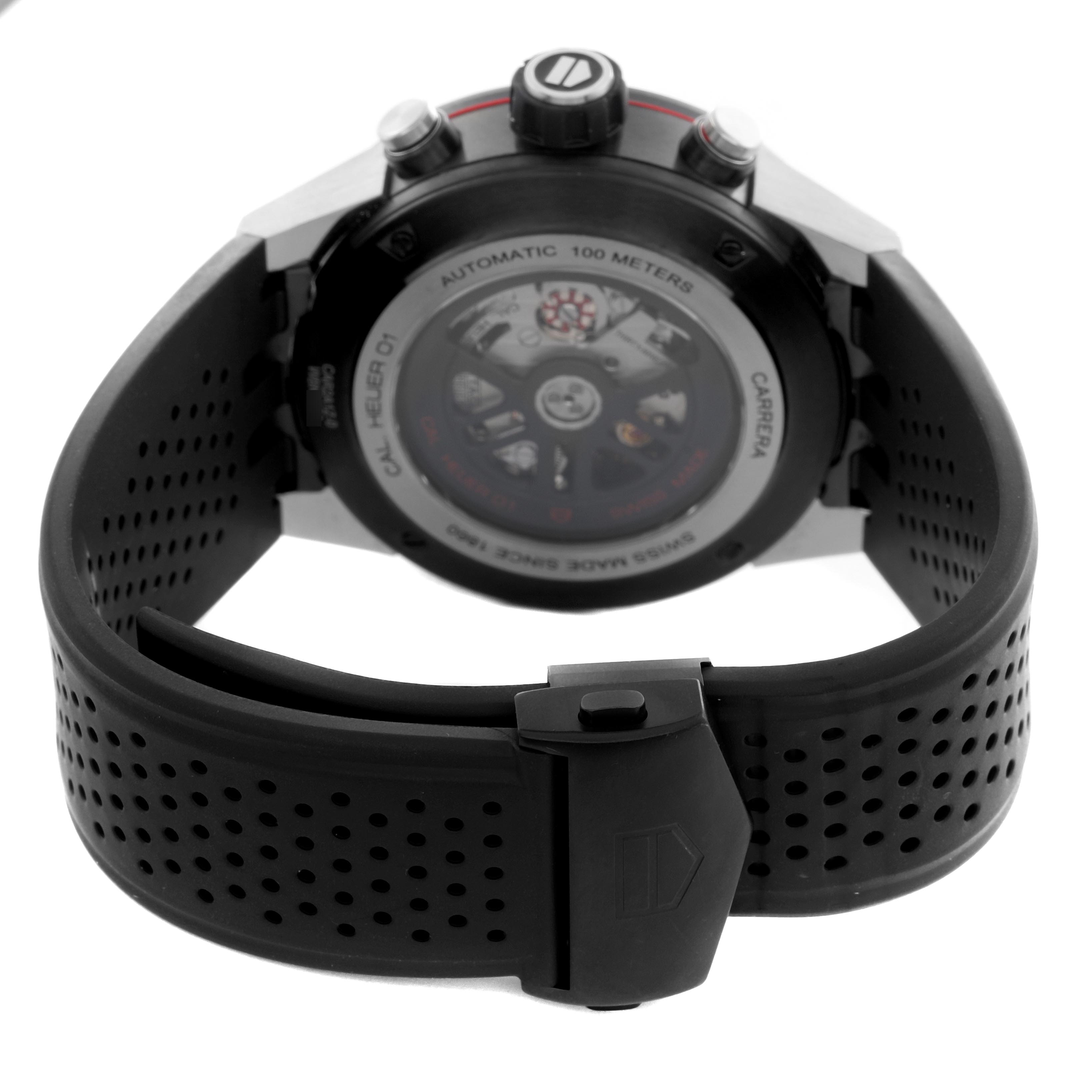 The image shows the Tag Heuer Carrera CAR2A1Z.FT6051 Men's Stainless Steel Black Dial CAR2A1Z.FT6051 Men's Stainless Steel Black Dial watch from the back, highlighting the transparent case back and black strap.