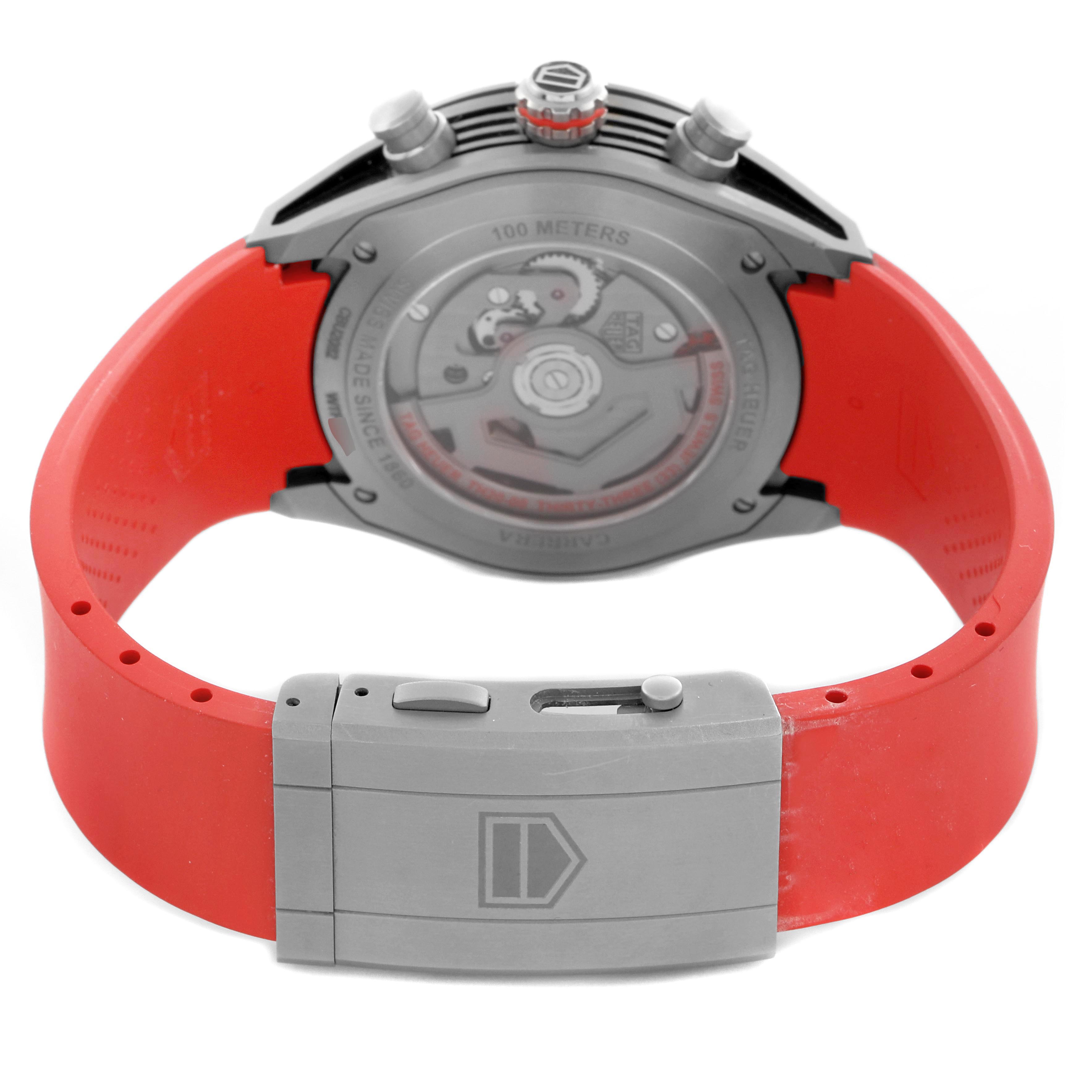The Tag Heuer Carrera CBU2082 Men
s Titanium Red Dial CBU2082 Men
s Titanium Red Dial watch is shown from the back, highlighting the case back and red strap.