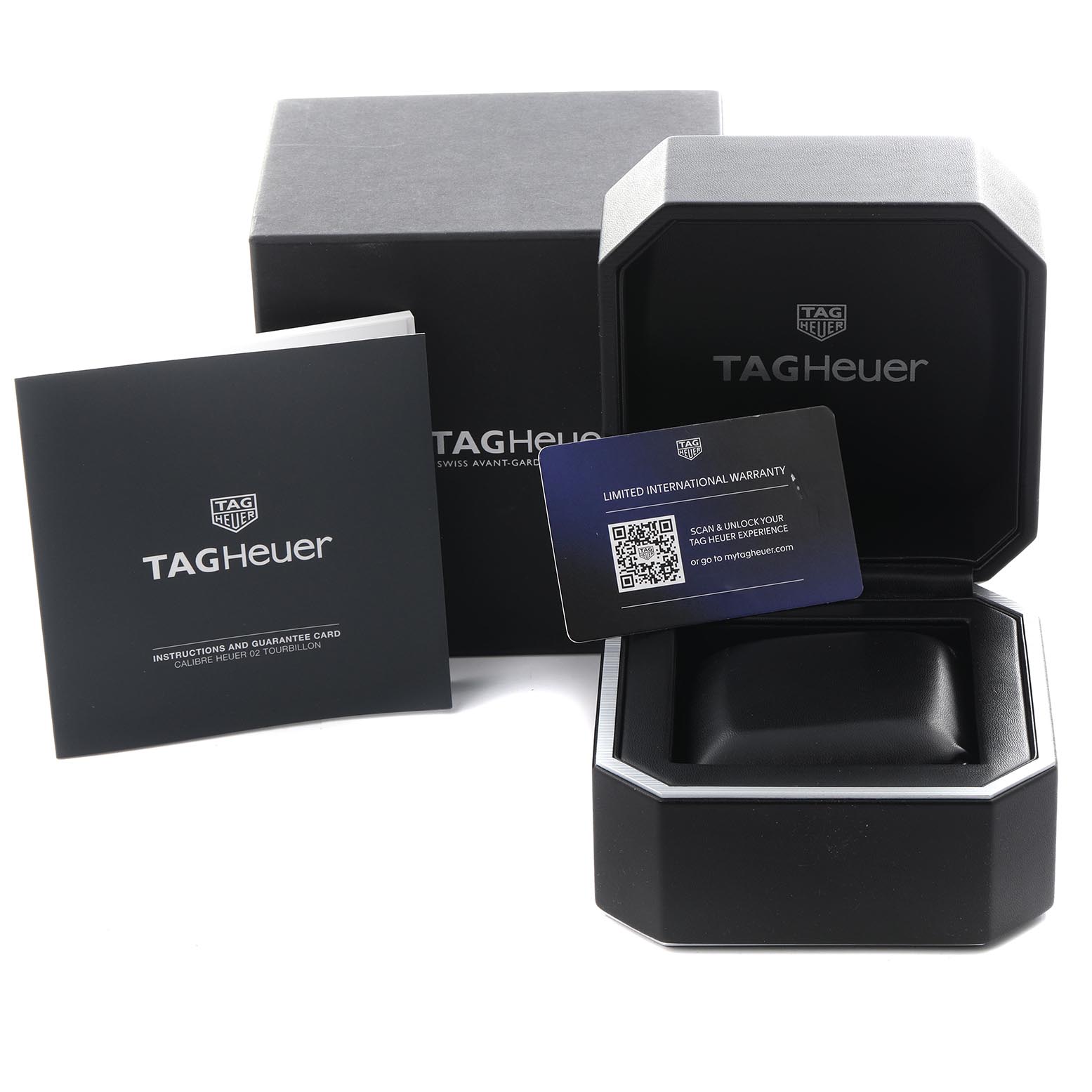 The image shows a Tag Heuer Carrera CAR5A8AF Men's Titanium Black Dial CAR5A8AF Men's Titanium Black Dial watch box, instruction booklet, and warranty card from a front angle.