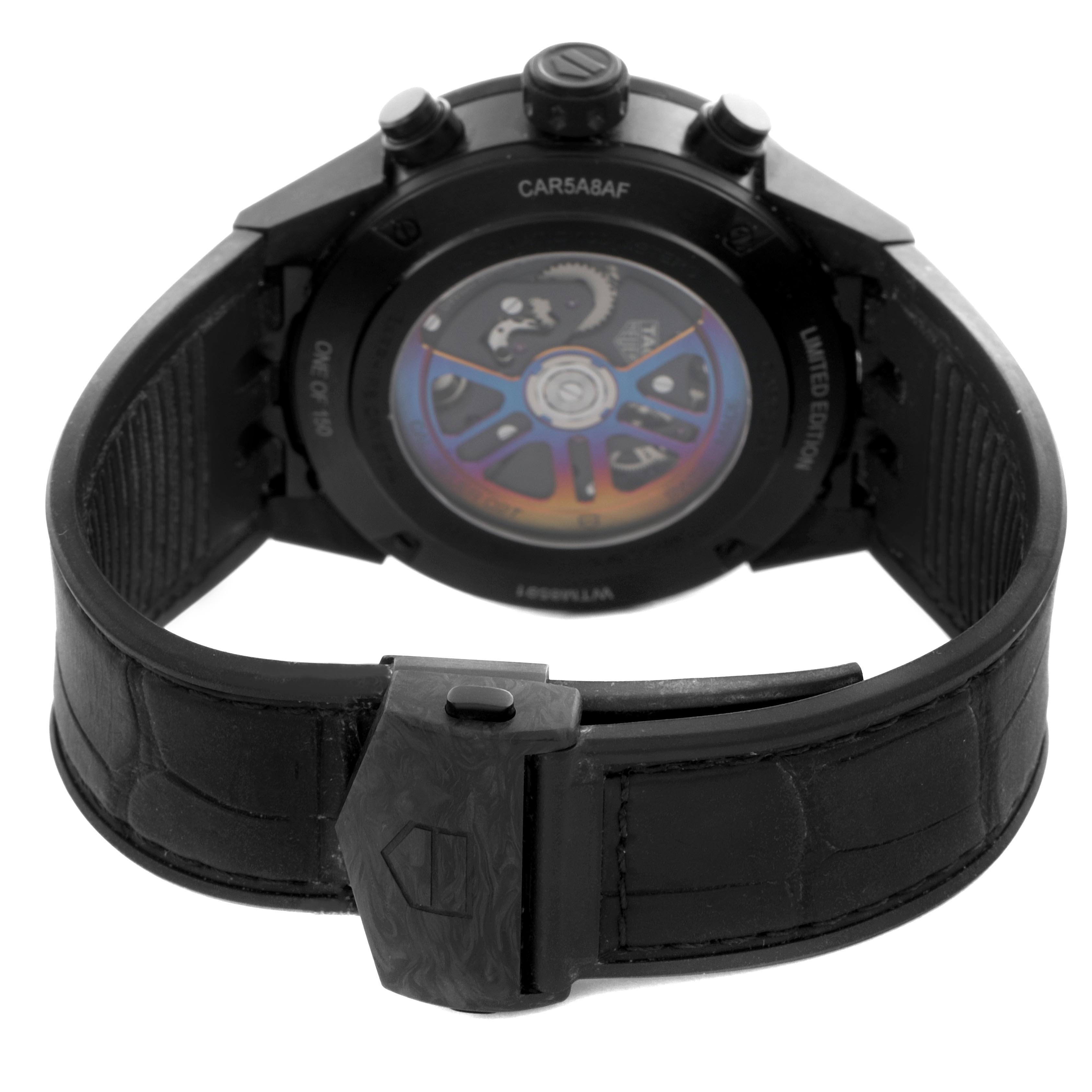 The image shows the back of a Tag Heuer Carrera CAR5A8AF Men's Titanium Black Dial CAR5A8AF Men's Titanium Black Dial watch, highlighting the caseback and movement through a transparent cover.