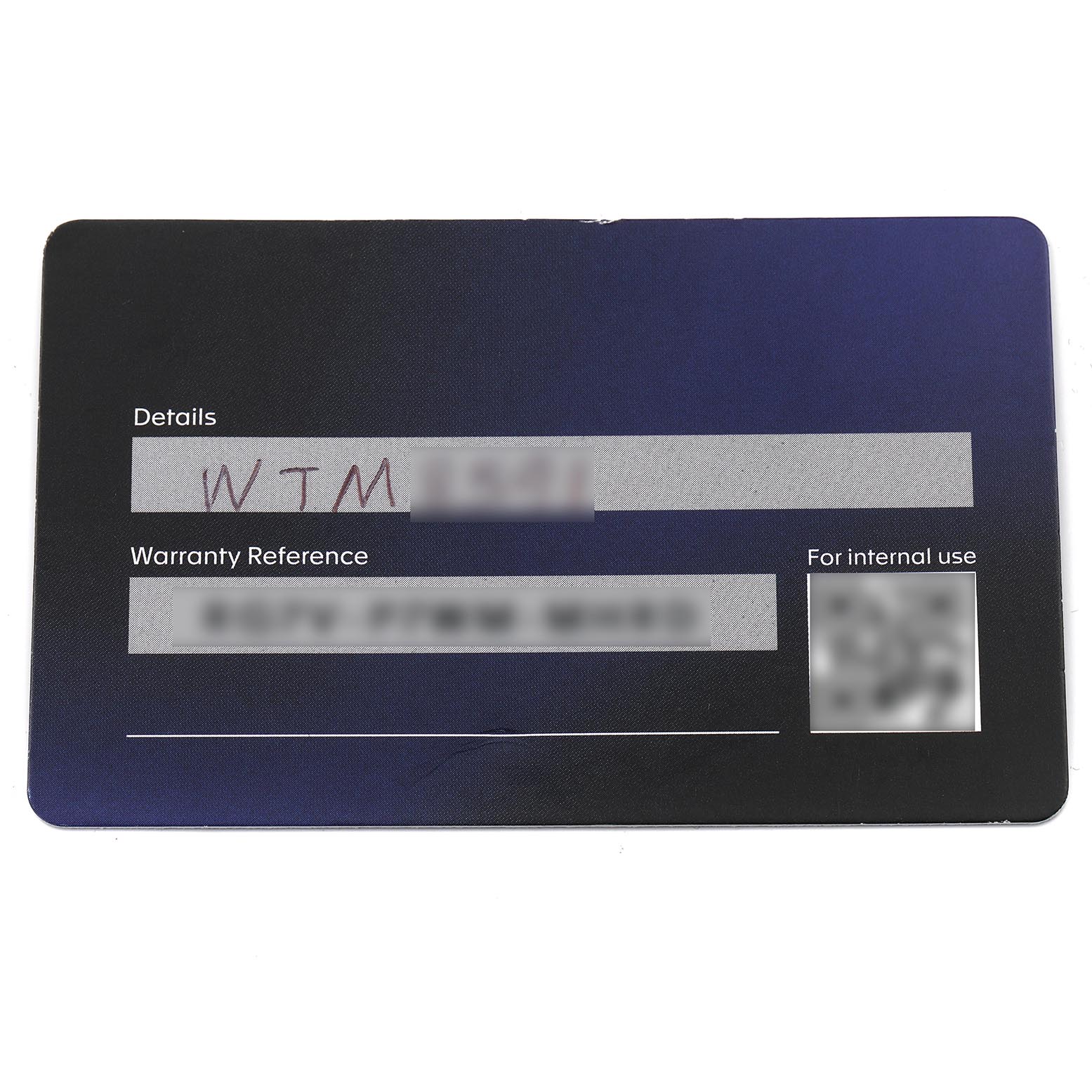 The image shows a warranty card for the Tag Heuer Carrera CAR5A8AF Men's Titanium Black Dial CAR5A8AF Men's Titanium Black Dial model from a top-down angle.