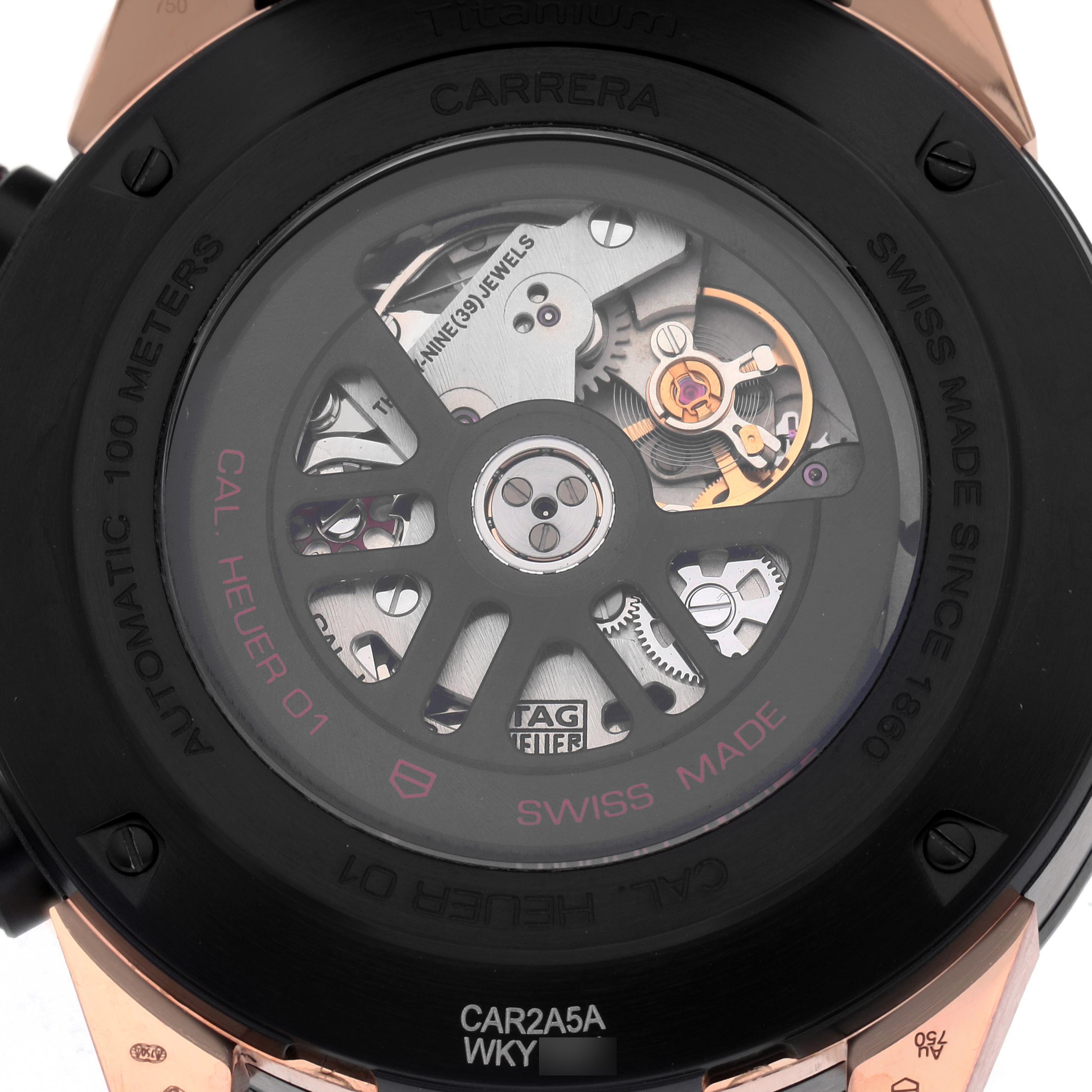 The image shows the back of a Tag Heuer Carrera CAR2A5A Men's Titanium Black Dial CAR2A5A Men's Titanium Black Dial model, highlighting the movement mechanism through a transparent case back.