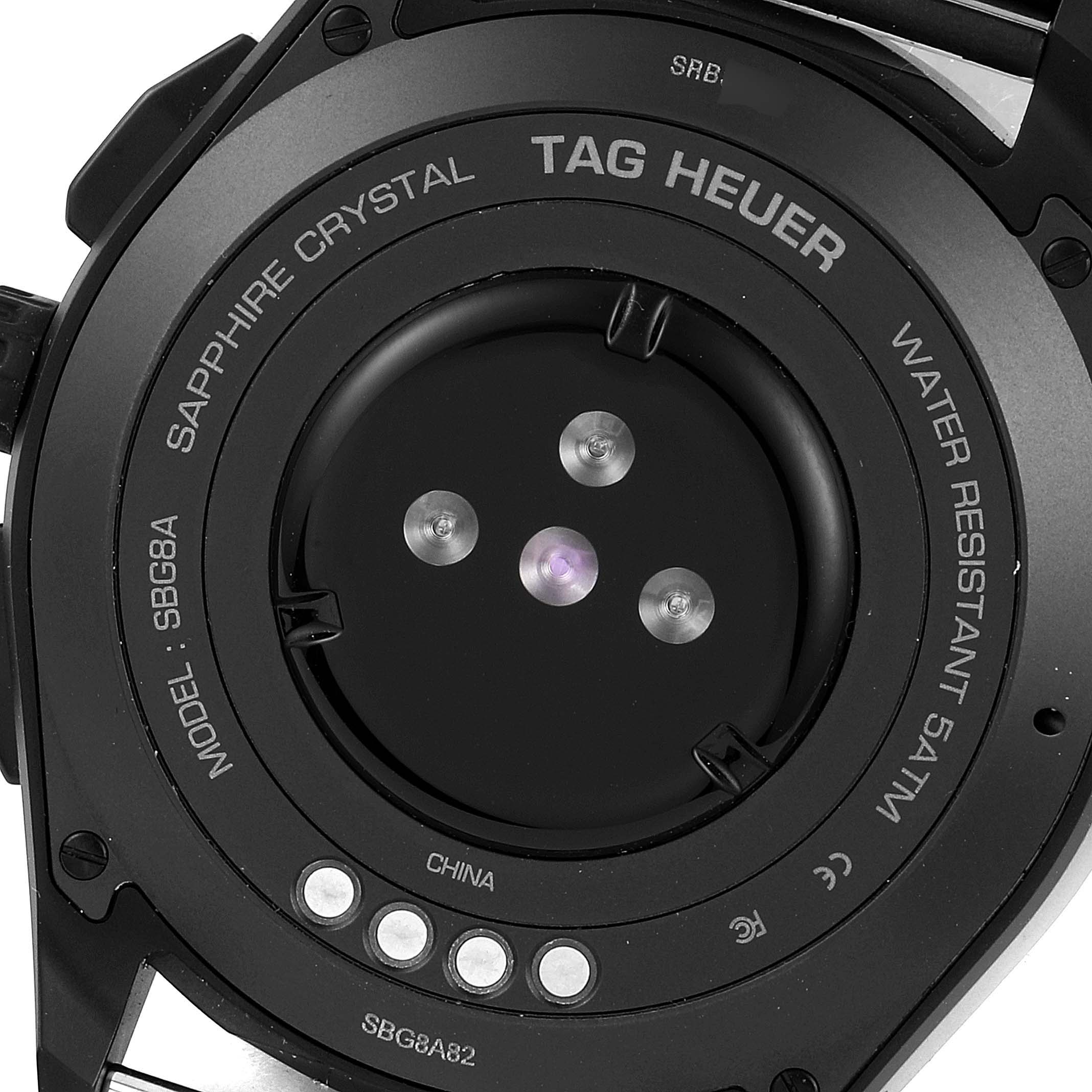 This is the back view of a Tag Heuer Connected SBG8A82.EB0206 Men's Titanium  SBG8A82.EB0206 Men's Titanium  model watch, showing the charging and sensor area.