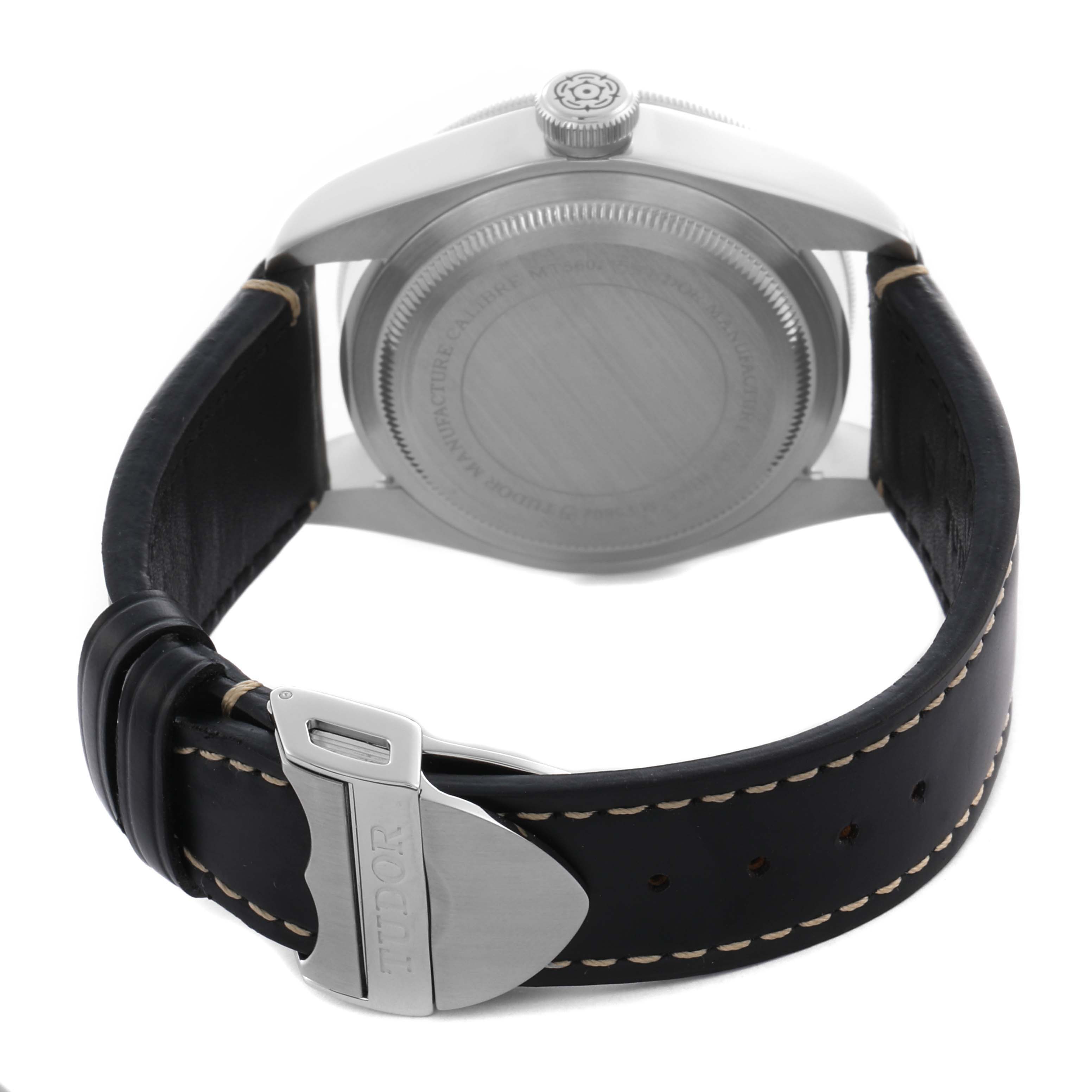 The image shows the back view of the Tudor Heritage Black Bay 79230B Men's Stainless Steel Black Dial 79230B Men's Stainless Steel Black Dial, highlighting the case back, crown, and leather strap with a buckle.