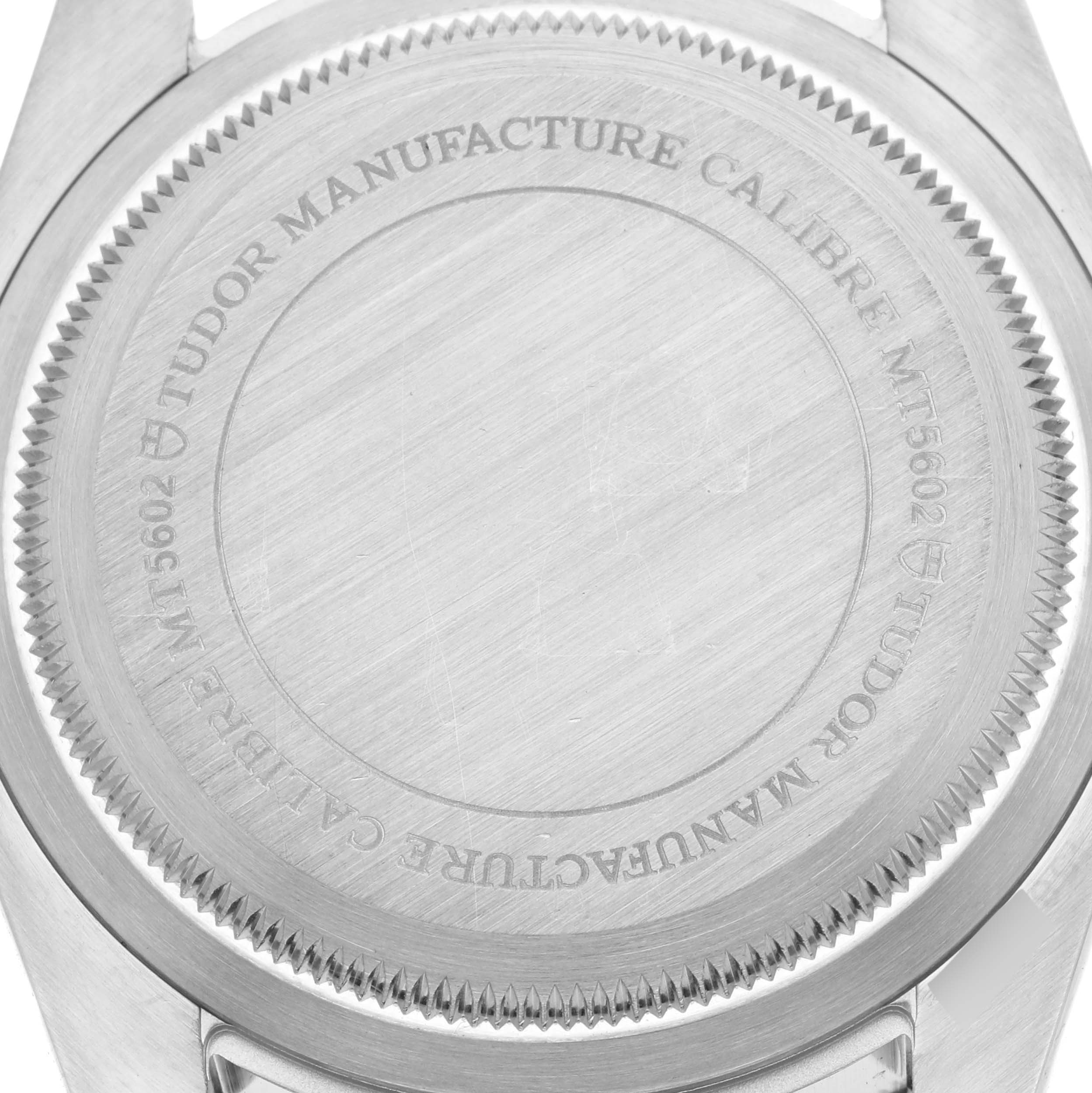 The image shows the back case of the Tudor Heritage Black Bay 79230B Men's Stainless Steel Black Dial 79230B Men's Stainless Steel Black Dial watch, focusing on the engraved details.