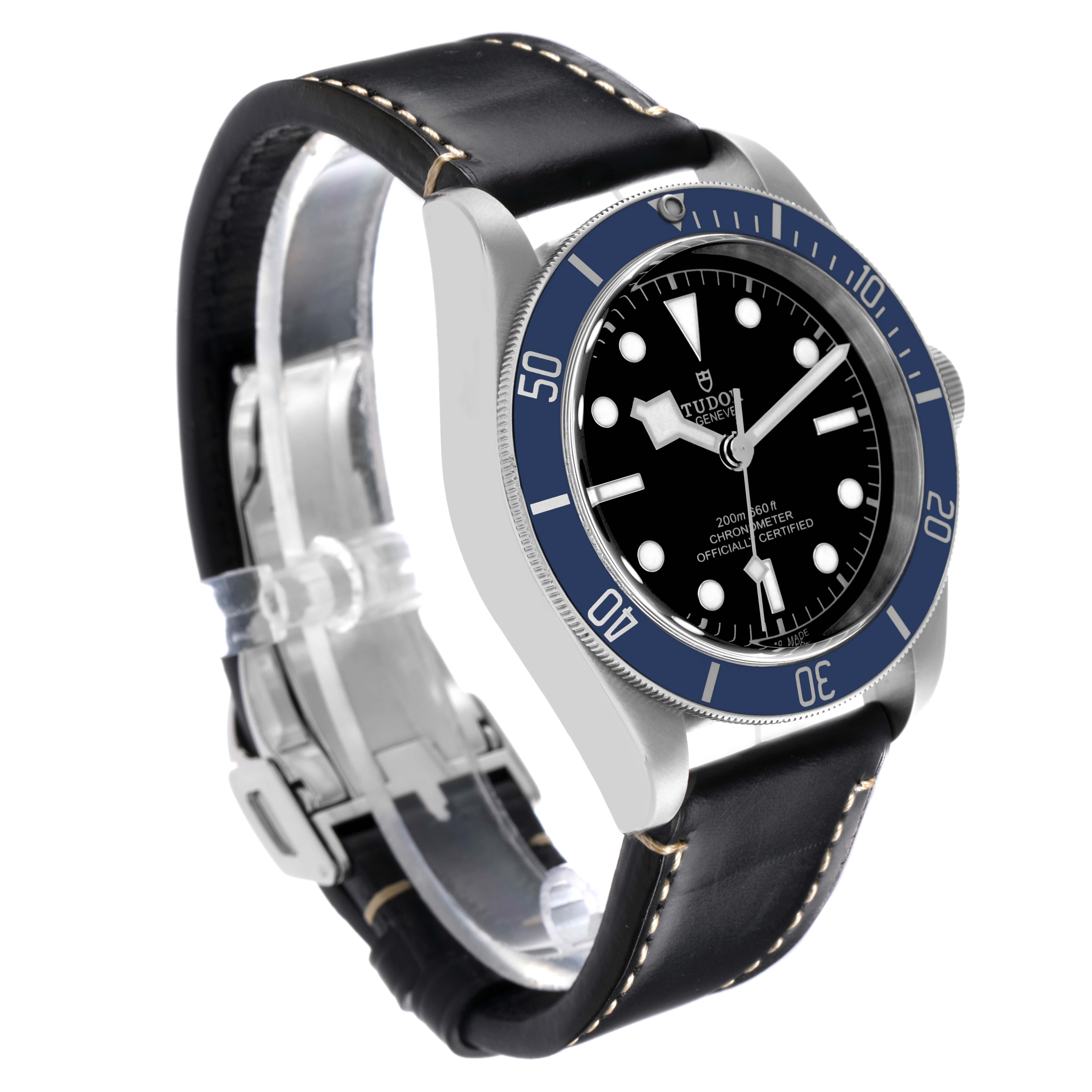 The Tudor Heritage Black Bay 79230B Men's Stainless Steel Black Dial 79230B Men's Stainless Steel Black Dial watch is shown at a three-quarter angle, highlighting its black dial, blue bezel, and leather strap.