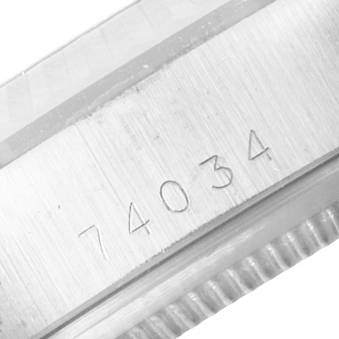 This close-up image shows the model number "74034" engraved on the case of the Tudor Prince 74034 Men's Stainless Steel Silver Dial 74034 Men's Stainless Steel Silver Dial watch.