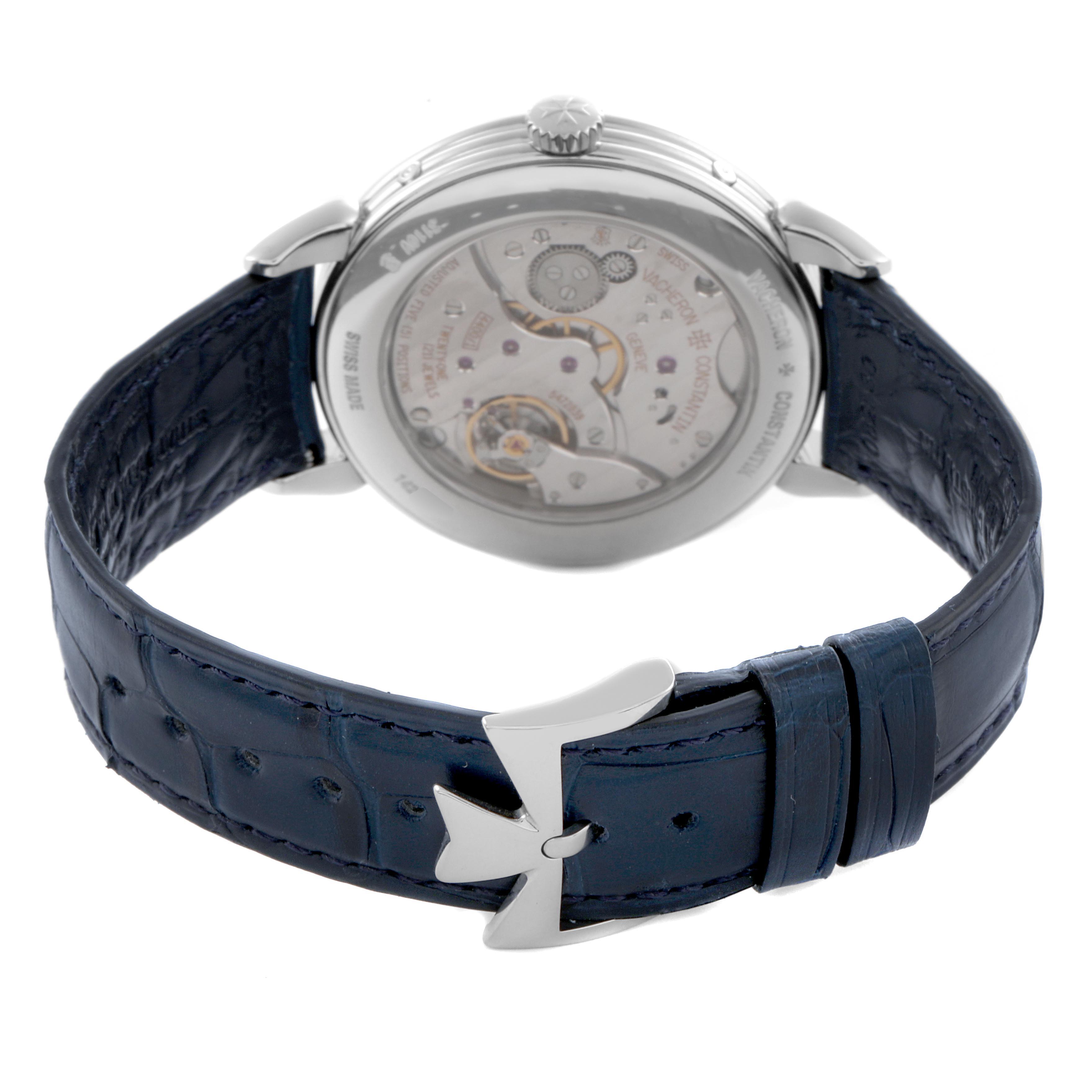 The image shows the back view of the Vacheron Constantin Historiques 3110V/000A-B425 Men's Stainless Steel Silver Dial 3110V/000A-B425 Men's Stainless Steel Silver Dial watch, highlighting its movement and blue leather strap with clasp.
