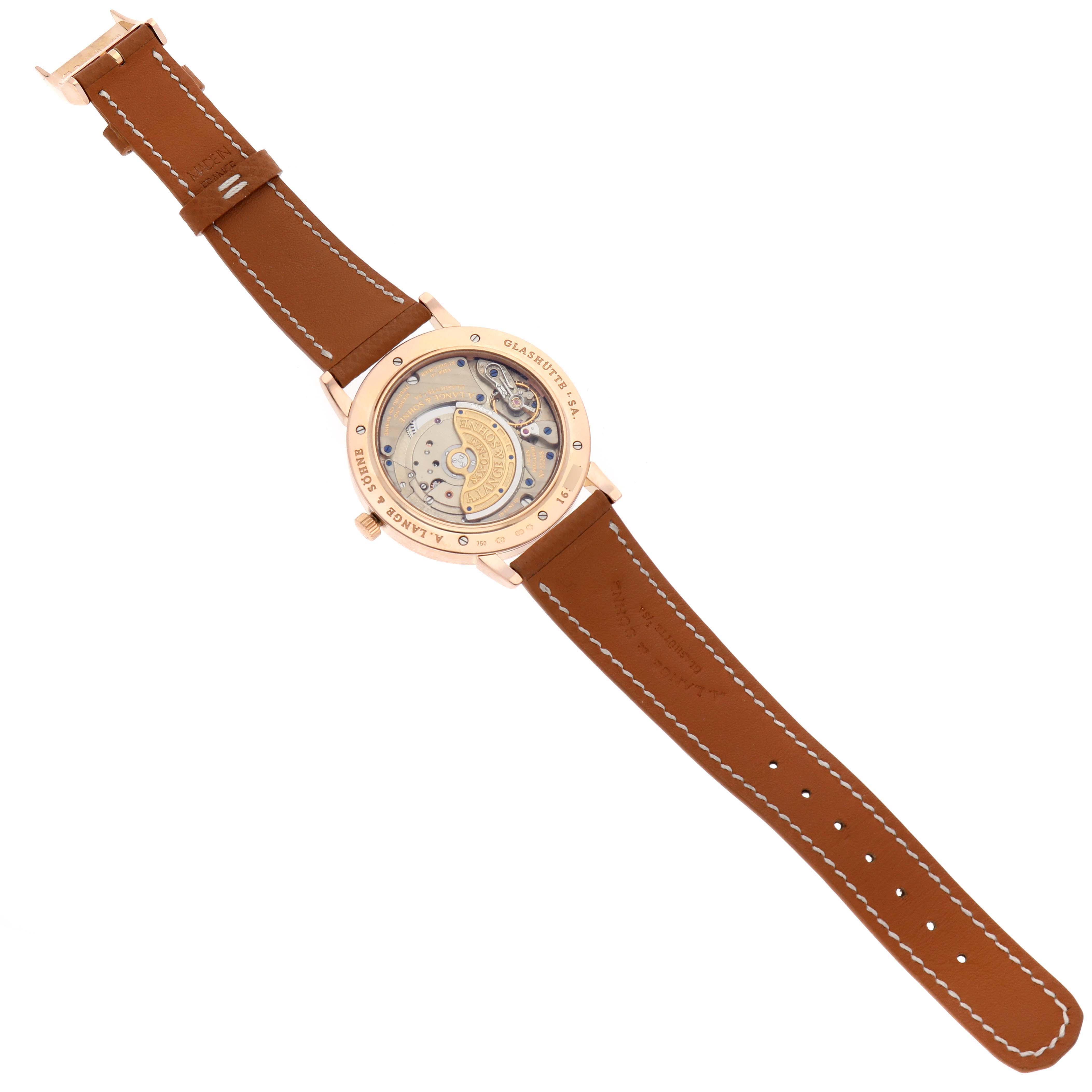 The image shows the back view of the A. Lange 
Sohne Saxonia 307.033 Men
s Rose Gold Grey Dial watch, displaying its movement and leather strap.