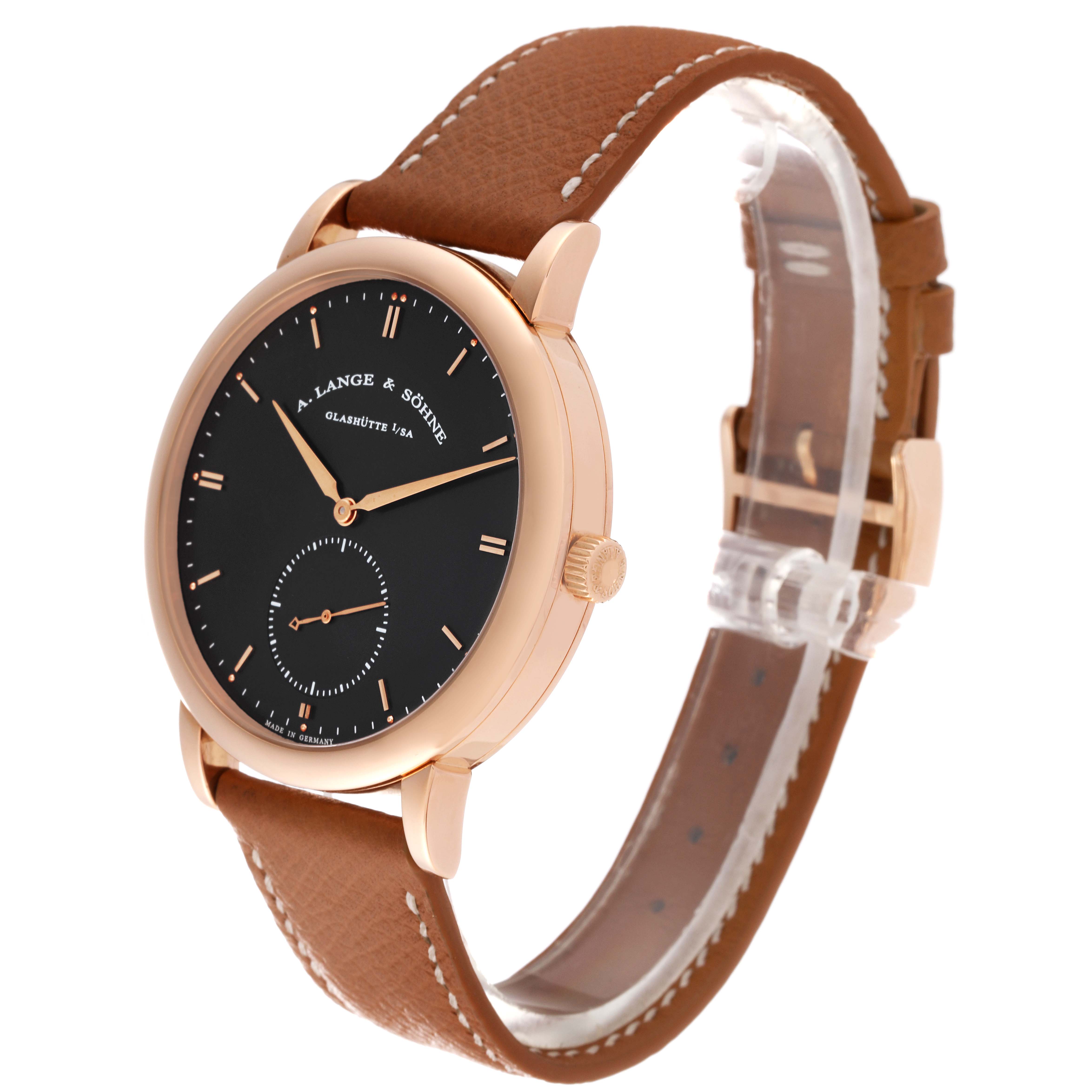 This image shows a Saxonia model watch by A. Lange 
Söhne from a three-quarter angle, featuring the face, crown, and brown leather strap.