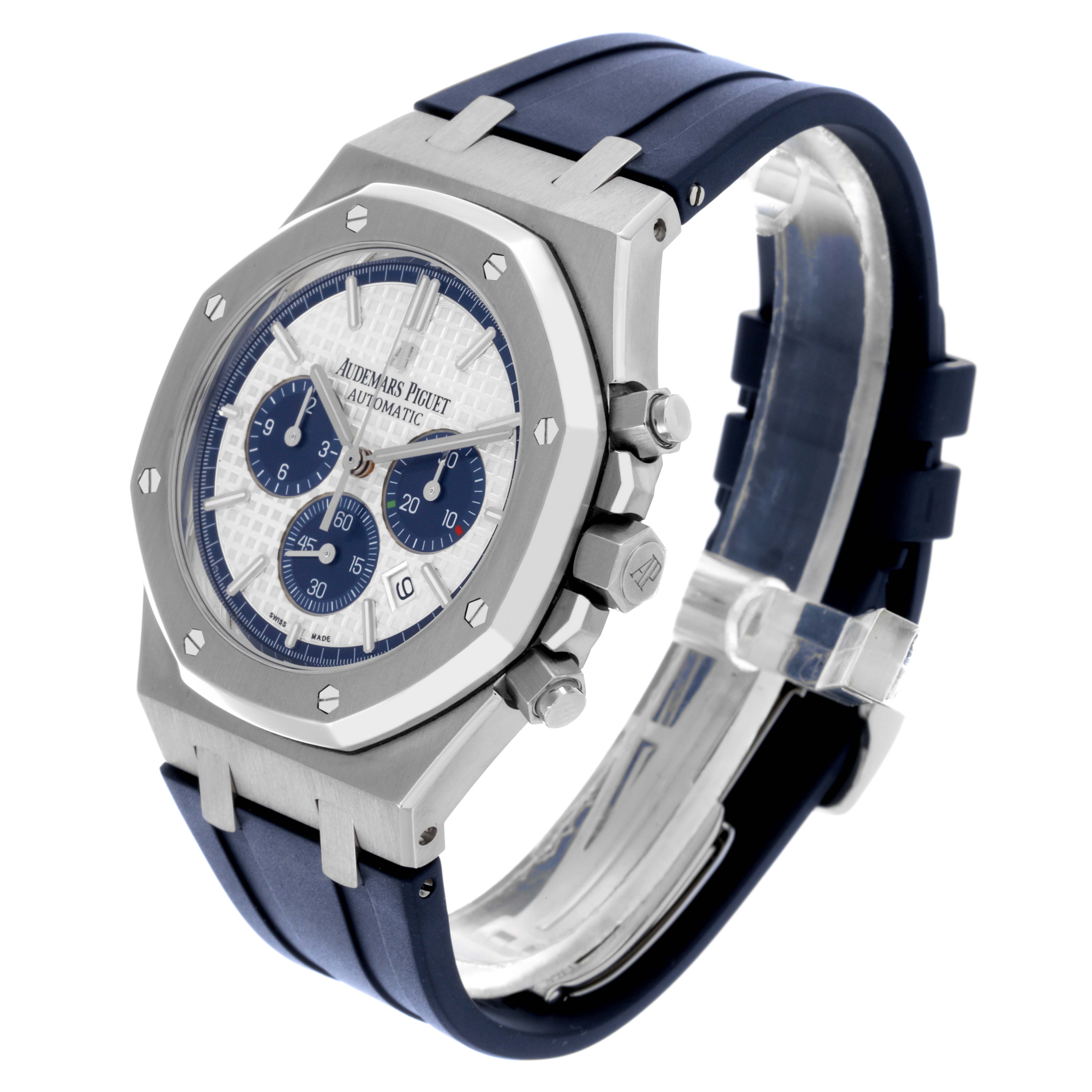 The Audemars Piguet Royal Oak 26326ST.OO.D027CA.01 Men's Stainless Steel White Dial 26326ST.OO.D027CA.01 Men's Stainless Steel White Dial watch is shown at a three-quarter angle, displaying its octagonal bezel, chronograph dials, and blue strap.
