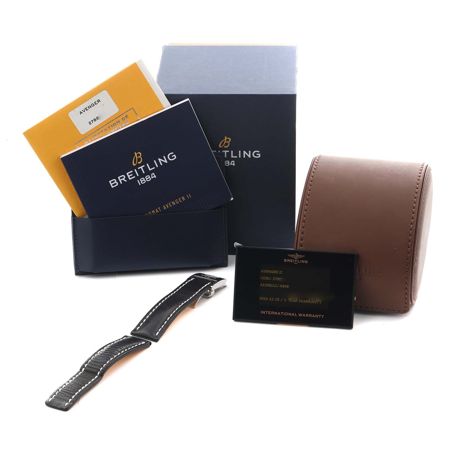 The image shows a Breitling Avenger A1338111/A808 Men's Stainless Steel Mother of Pearl Dial A1338111/A808 Men's Stainless Steel Mother of Pearl Dial watch box, warranty card, manuals, and a spare strap from a slightly elevated angle.