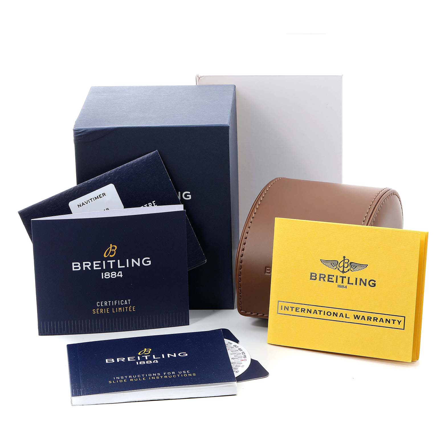 This image shows packaging and documentation for a Breitling Navitimer U17326211M1P1 Men's Stainless Steel Grey Dial U17326211M1P1 Men's Stainless Steel Grey Dial watch, including boxes, a travel case, manuals, and a warranty card.