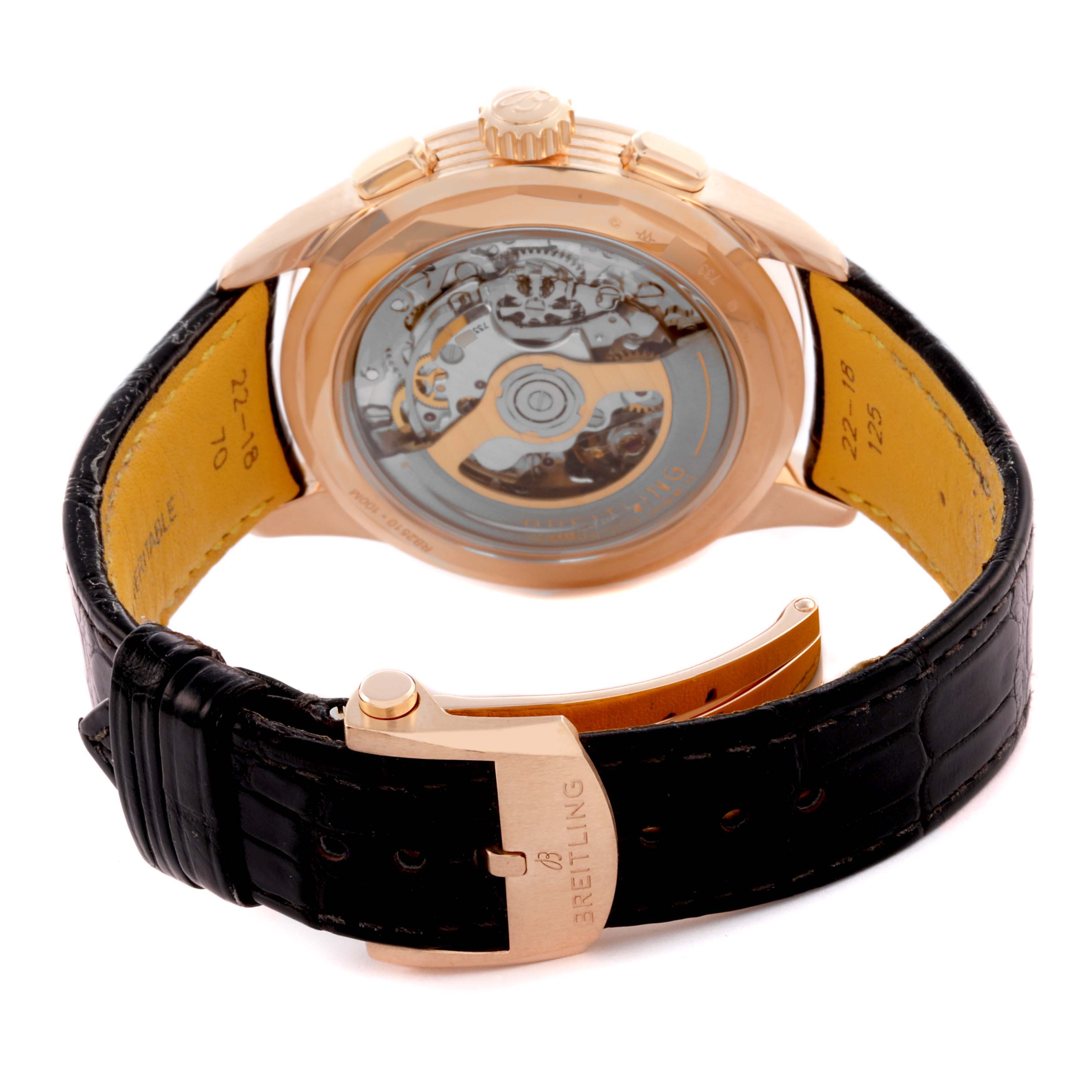 The image shows the rear angle of the Breitling Premier RB2510 Men's Rose Gold Silver Dial RB2510 Men's Rose Gold Silver Dial watch, highlighting its open case back and black leather strap.