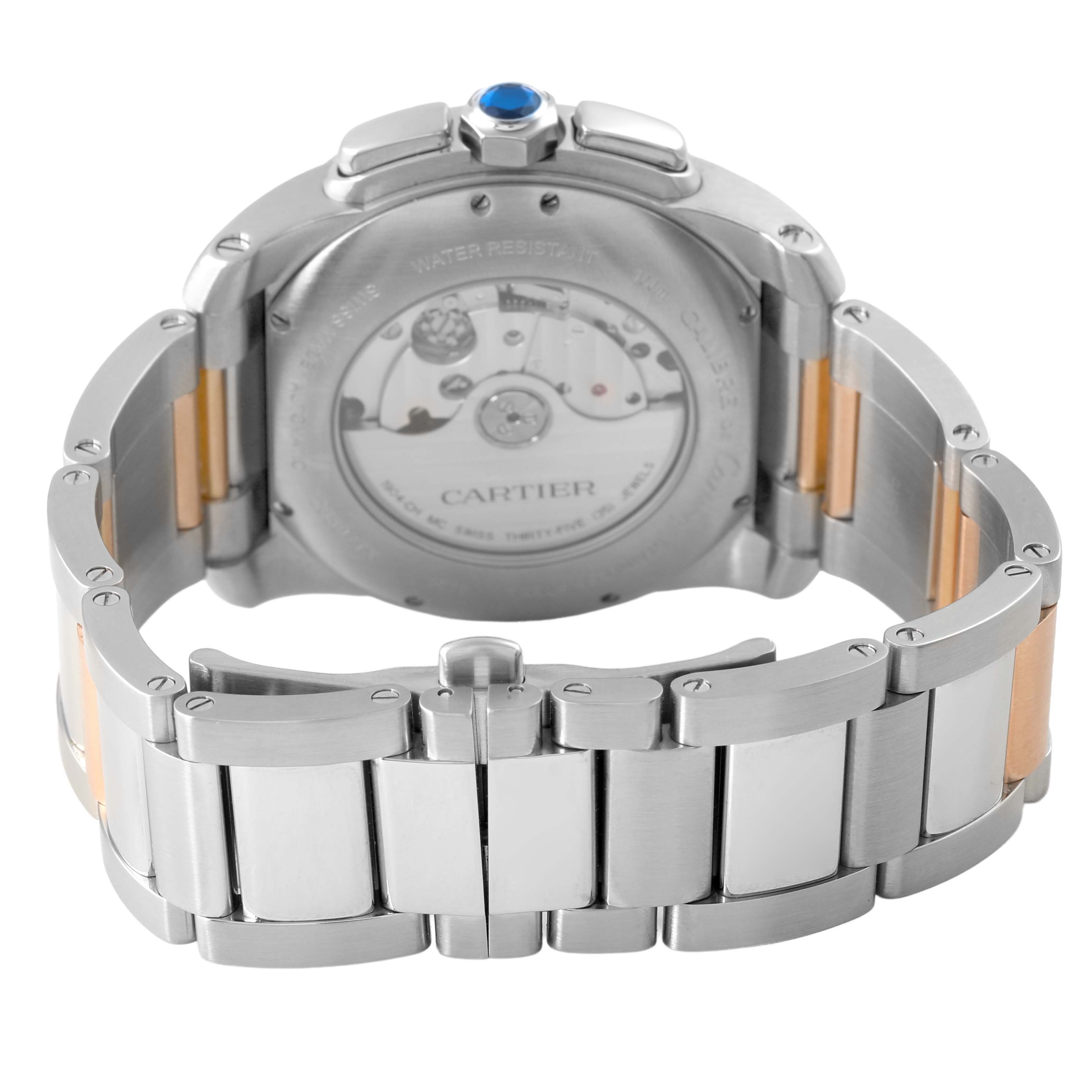 The image shows the back view of the Calibre de Cartier watch by Cartier, highlighting its metal bracelet and case back.