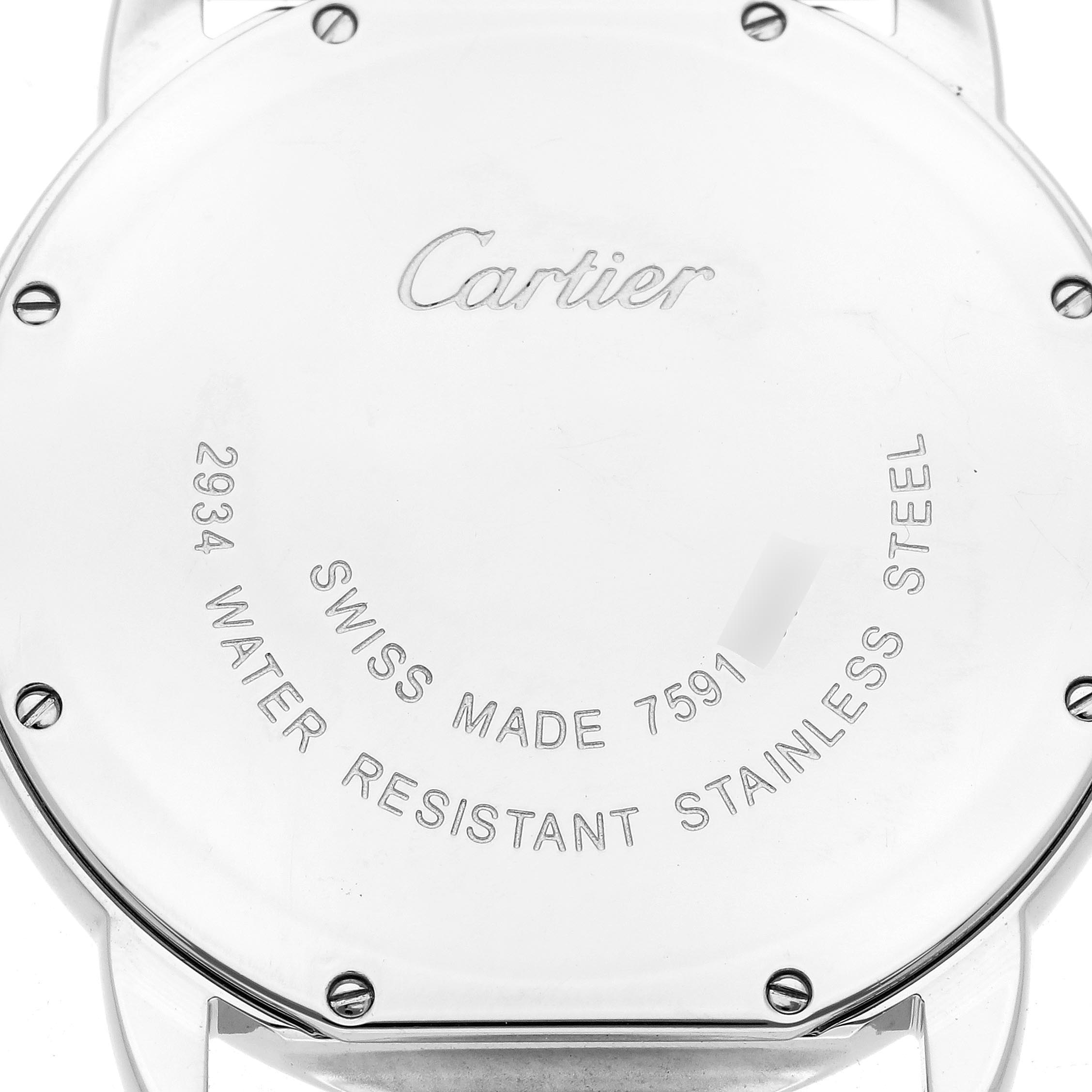 The image shows the back case of a Cartier Ronde W6701005 Men
s Stainless Steel Silver Dial W6701005 Men
s Stainless Steel Silver Dial watch, highlighting its screws and engraved details.