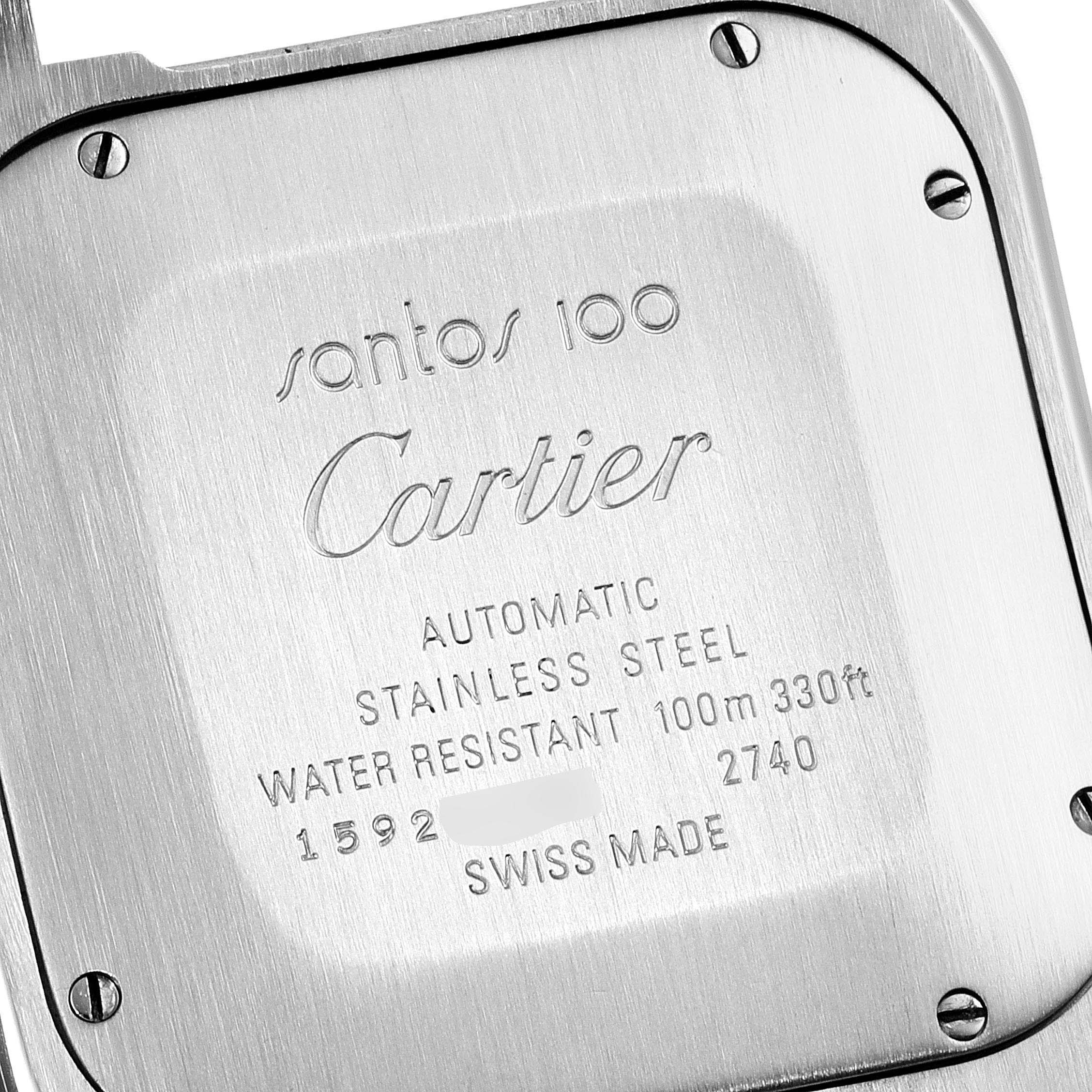 The image shows the back case of a Cartier Santos W20090X8 Men
s Stainless Steel Silver Dial W20090X8 Men
s Stainless Steel Silver Dial 100 watch, displaying engravings and screws.
