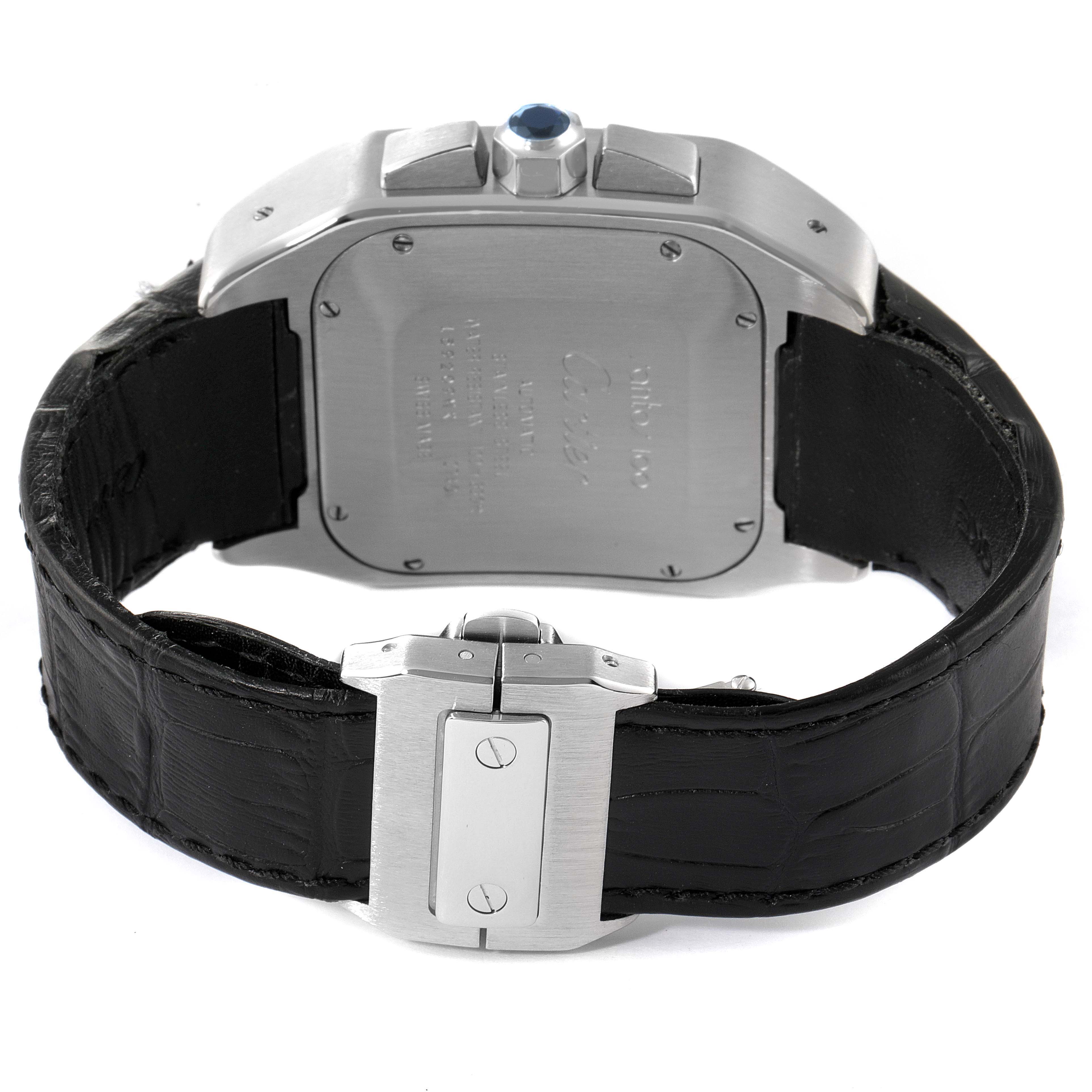 The image shows the Cartier Santos W20090X8 Men
s Stainless Steel Silver Dial W20090X8 Men
s Stainless Steel Silver Dial watch from the back, displaying the case back, crown, and leather strap with its clasp.