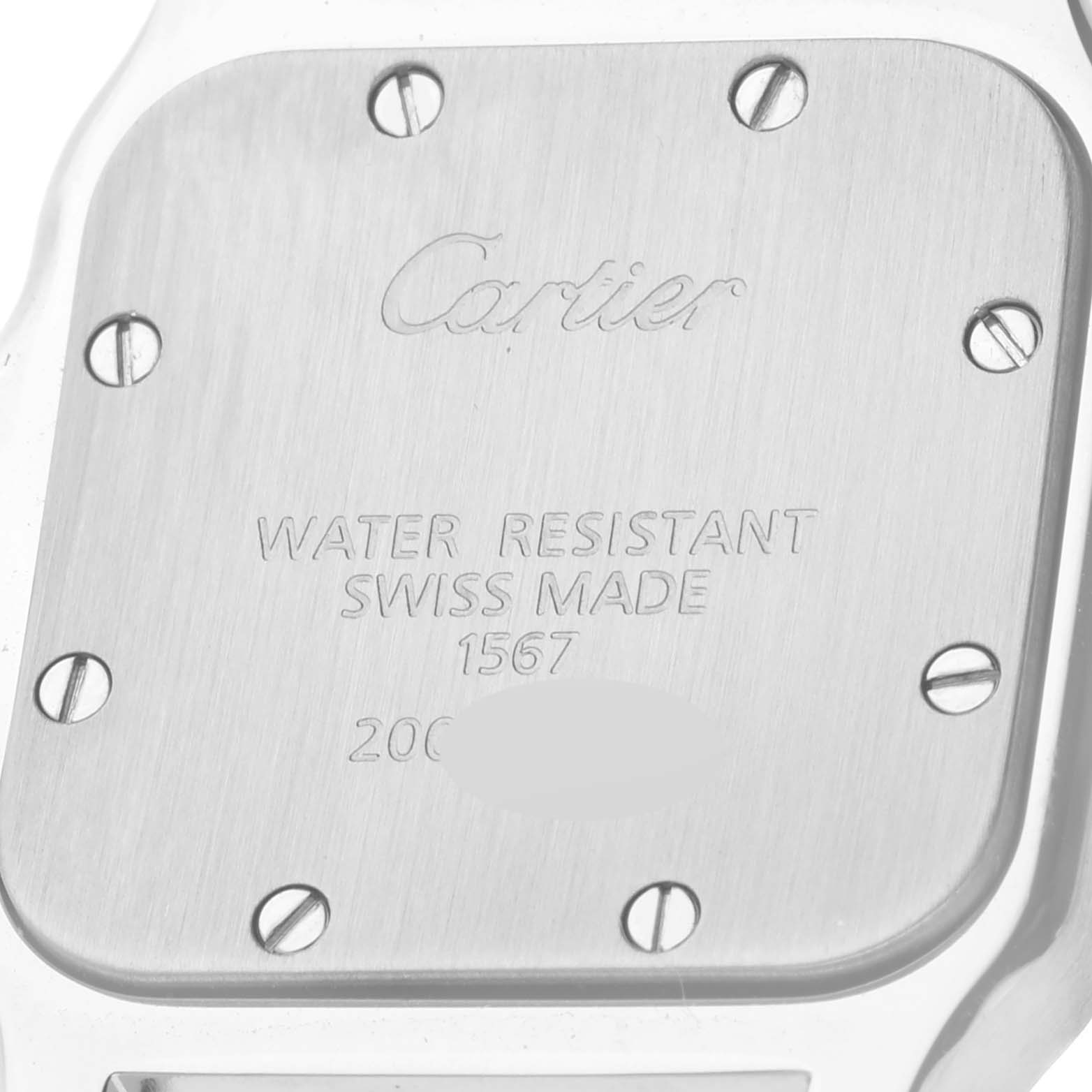 The image shows the back case of a Cartier Santos W20012C4 Women's Steel and Gold (two tone) Silver Dial W20012C4 Women's Steel and Gold (two tone) Silver Dial model watch, highlighting the engraved brand name, water resistance, and other inscriptions.