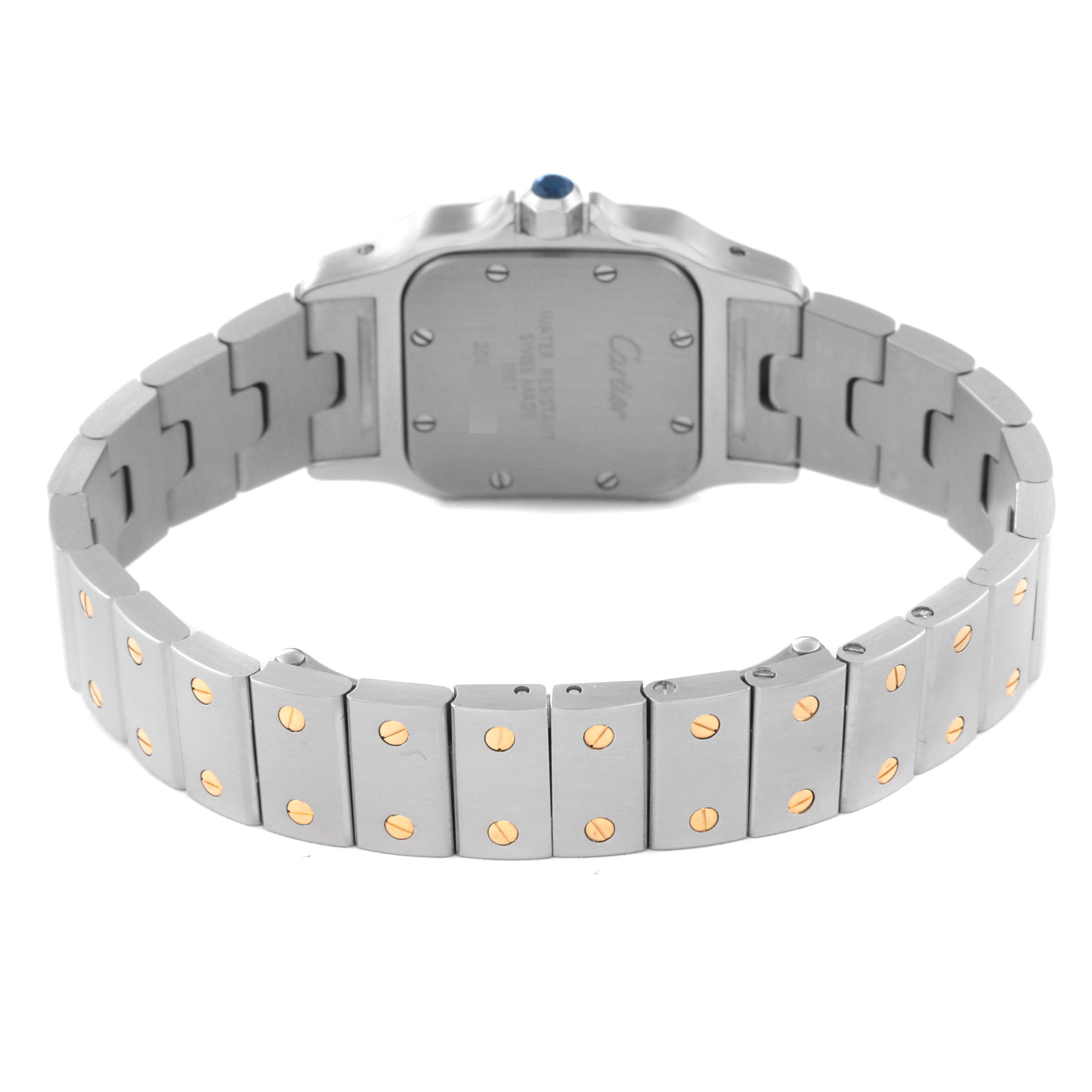 The image shows the rear view of a Cartier Santos W20012C4 Women's Steel and Gold (two tone) Silver Dial W20012C4 Women's Steel and Gold (two tone) Silver Dial watch, highlighting its back case and metallic bracelet.