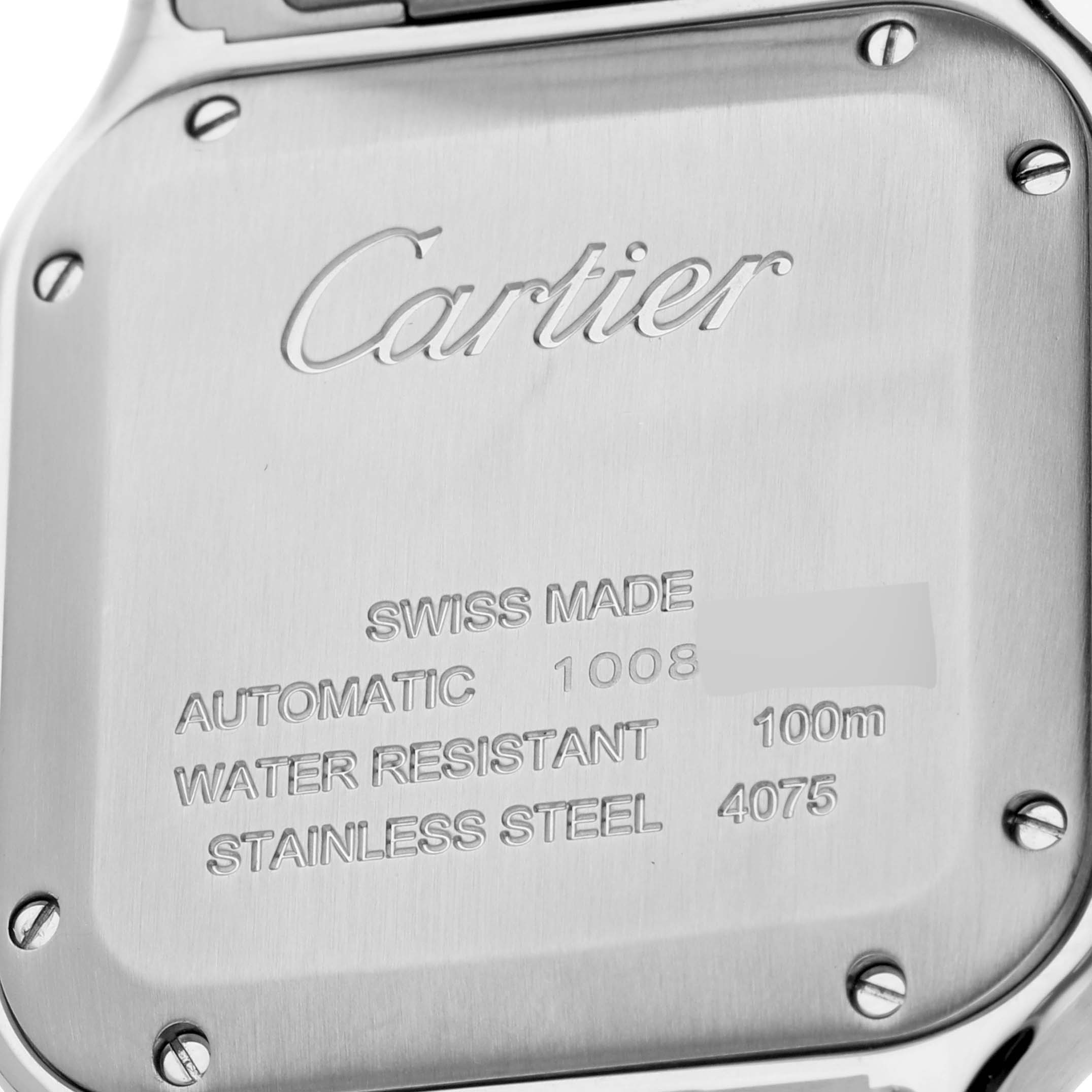 The image shows the case back of a Cartier Santos W2SA0007 Men's Steel and Gold (two tone) Silver Dial W2SA0007 Men's Steel and Gold (two tone) Silver Dial watch with inscriptions including the brand, model, and technical details.