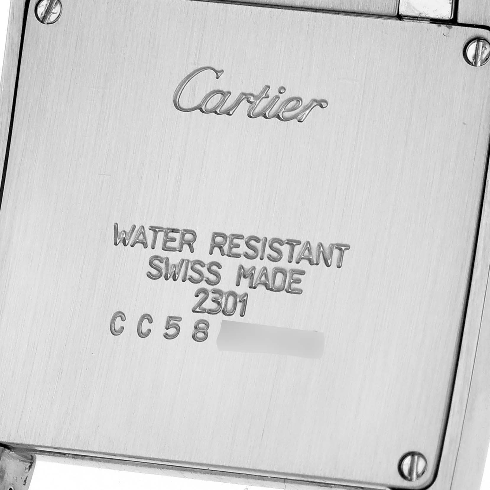 This image shows the back casing of a Cartier Tank Francaise W51003Q3 Women's Stainless Steel Silver Dial W51003Q3 Women's Stainless Steel Silver Dial watch with engraved details and screws visible.