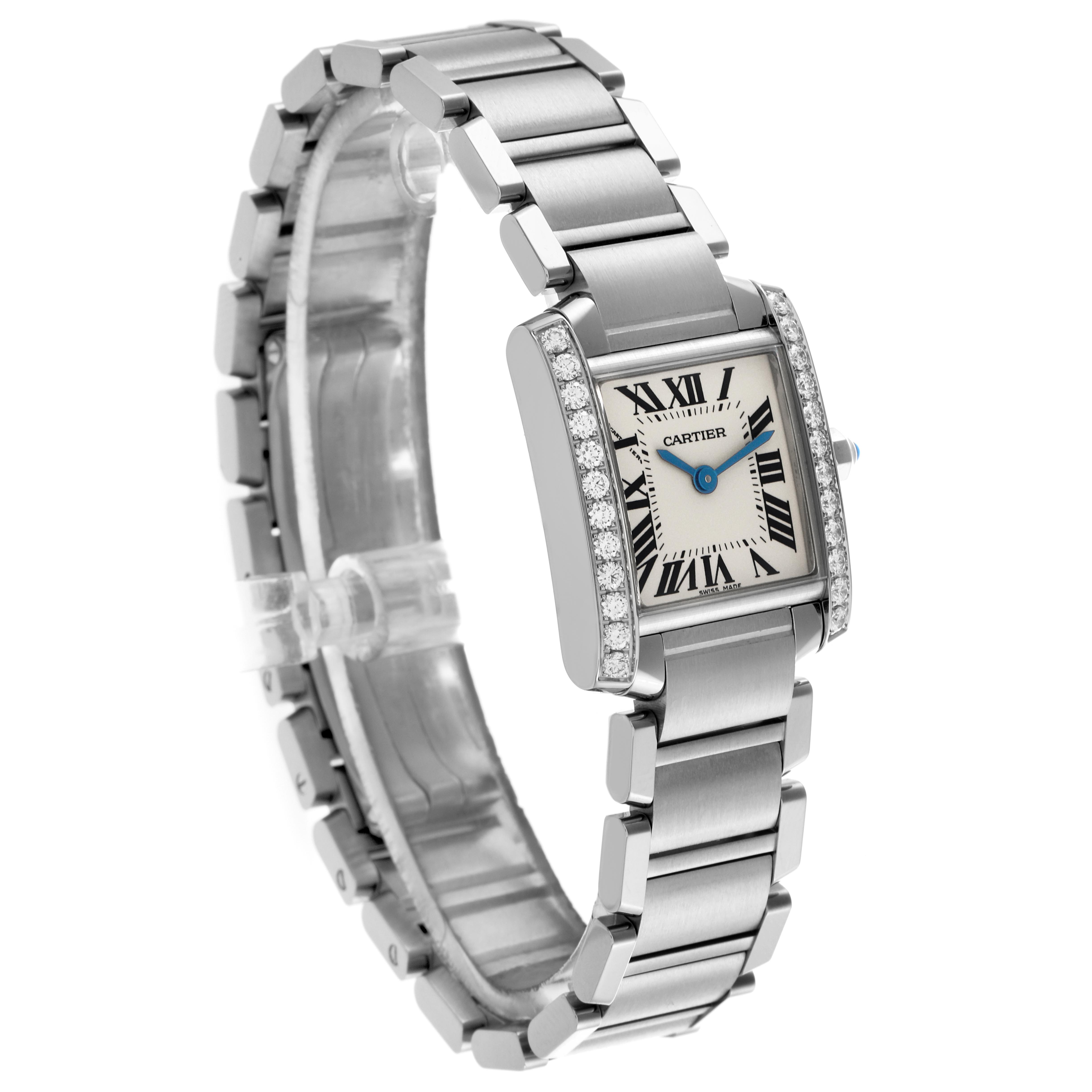 The Cartier Tank Française watch is shown at a three-quarter angle, displaying the face, diamond-set bezel, and stainless steel bracelet.