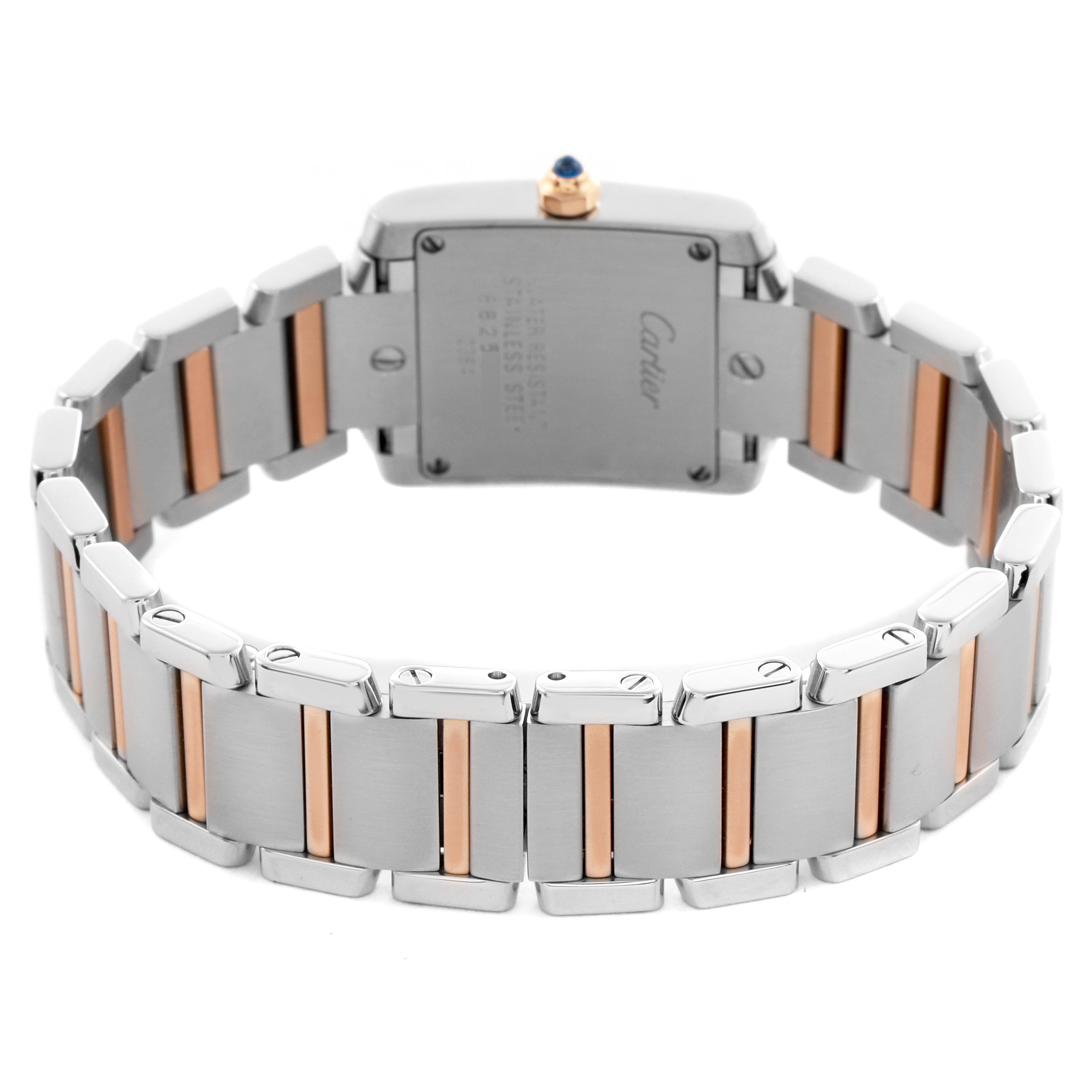 The image shows the back view of a Cartier Tank Française watch, highlighting its two-tone metal bracelet and case back.