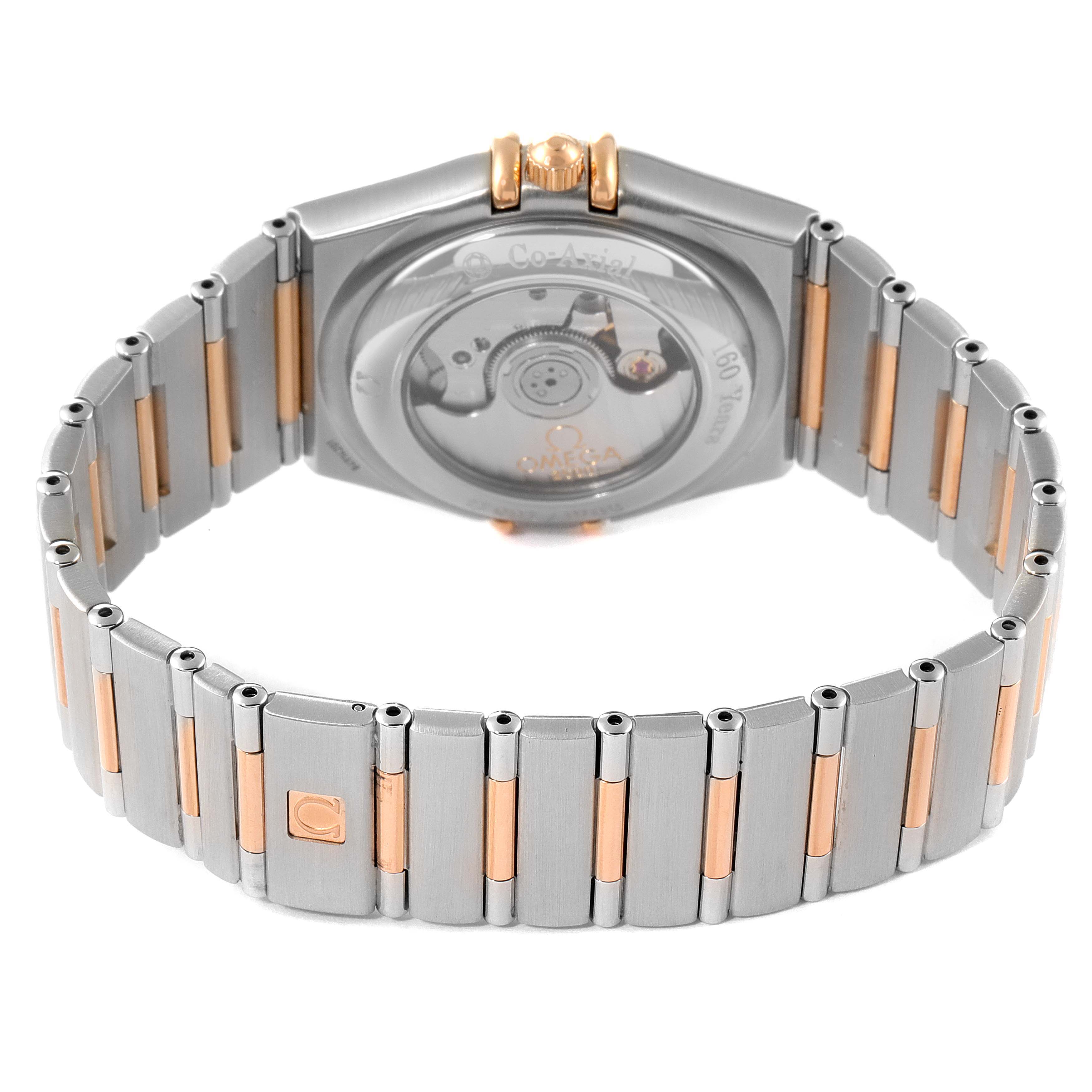 The image shows the back view of an Omega Constellation 111.25.36.20.52.001 Men's Steel and Gold (two tone) Silver Dial 111.25.36.20.52.001 Men's Steel and Gold (two tone) Silver Dial watch, highlighting its bracelet and exhibition case back.
