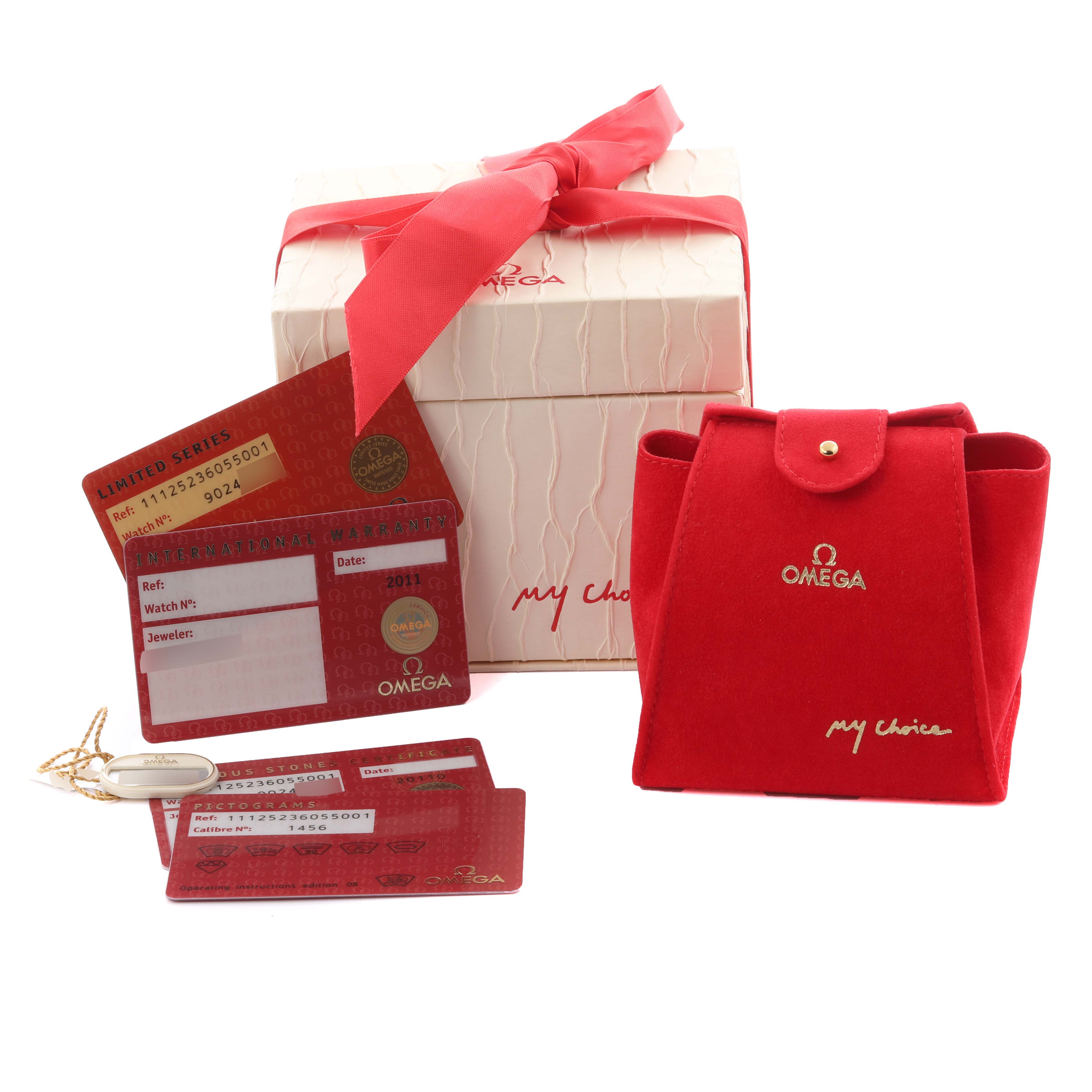 The image shows the packaging and accessories for the Omega 111.25.23.60.55.001 Women's Steel and Gold (two tone) Mother of Pearl Dial 111.25.23.60.55.001 Women's Steel and Gold (two tone) Mother of Pearl Dial Constellation Beijing Steel Yellow Gold Diamond Watch, including a box, red pouch, and warranty cards.