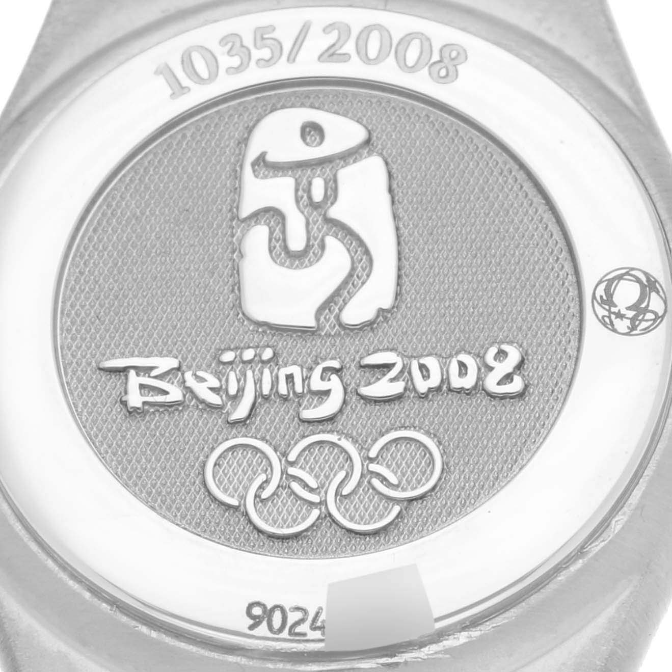 The image shows the back of the Omega 111.25.23.60.55.001 Women's Steel and Gold (two tone) Mother of Pearl Dial 111.25.23.60.55.001 Women's Steel and Gold (two tone) Mother of Pearl Dial Constellation Beijing Steel Yellow Gold Diamond Watch, featuring the Beijing 2008 logo.