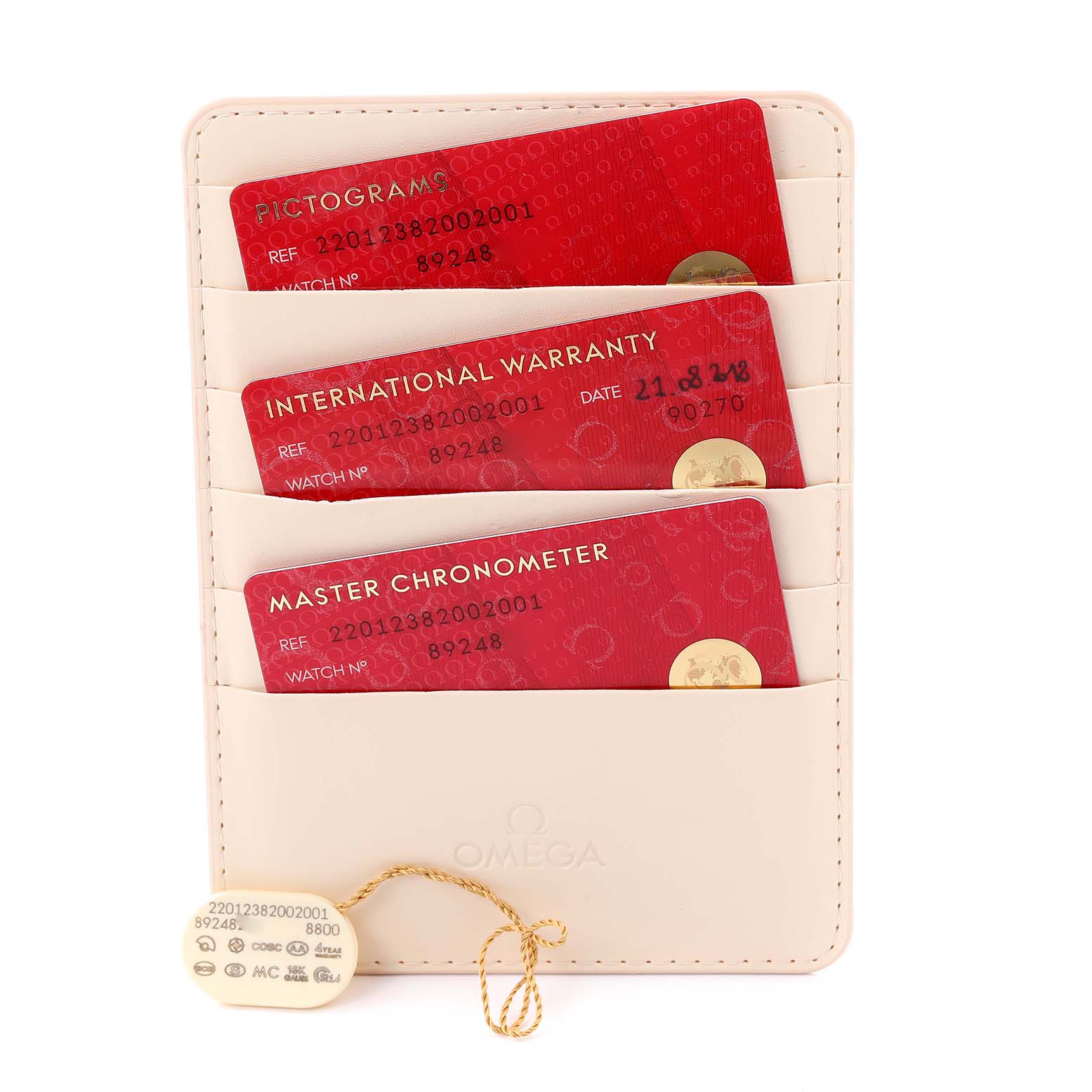 The image shows Omega Aqua Terra 220.12.38.20.02.001 Men's Stainless Steel Silver Dial 220.12.38.20.02.001 Men's Stainless Steel Silver Dial model warranty cards and a tag in a cardholder from a top view.