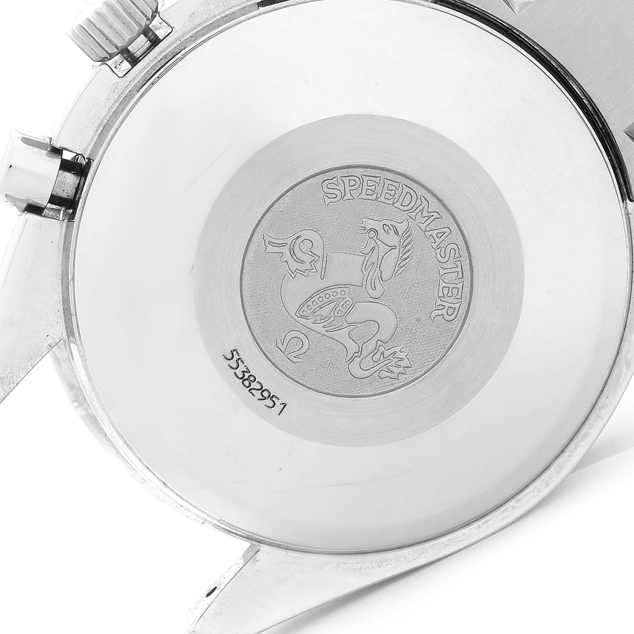 The image shows the back case of an Omega Speedmaster 3513.33.00 Men's Stainless Steel White Dial 3513.33.00 Men's Stainless Steel White Dial watch, highlighting its engraved emblem and serial number.