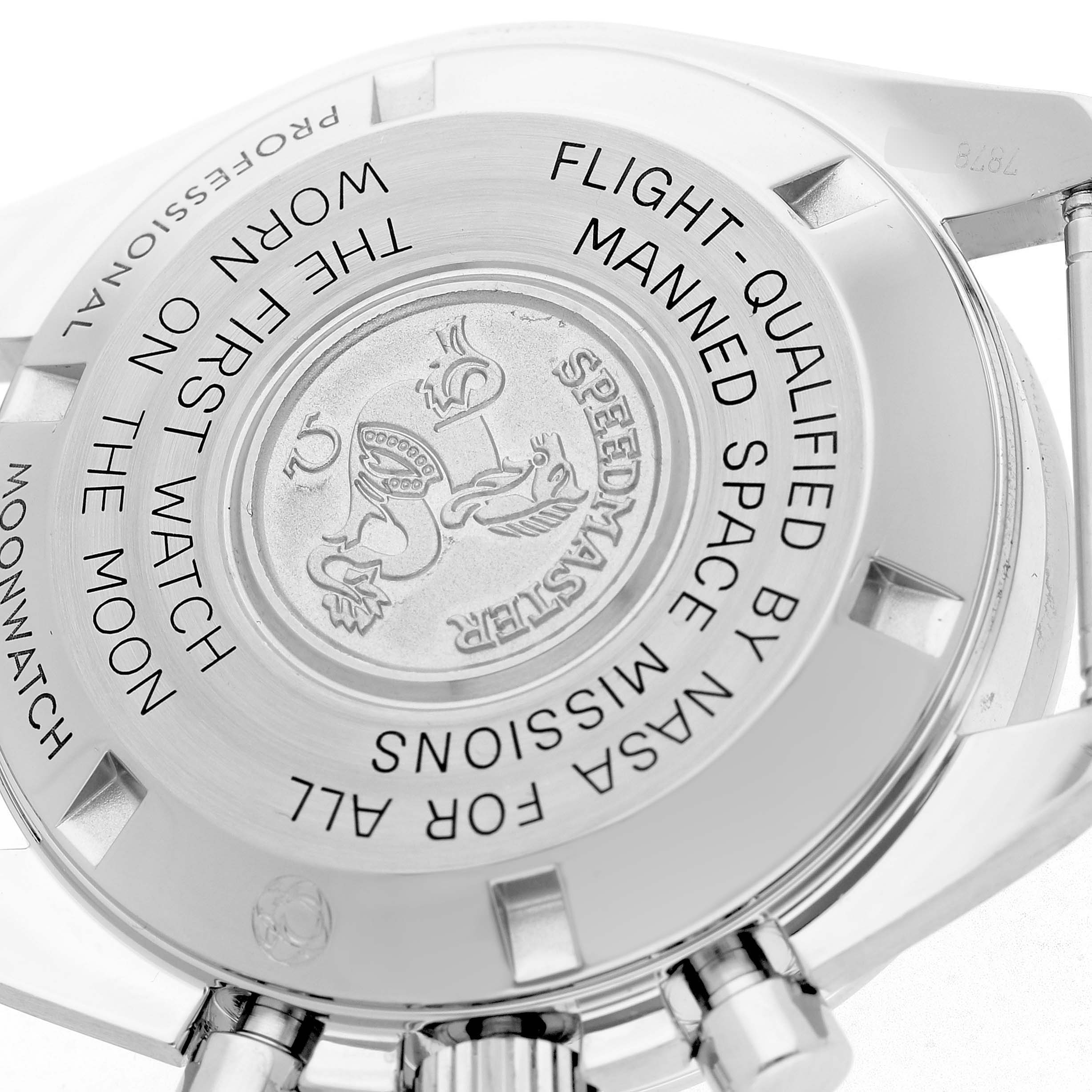 The image shows the case back of an Omega Speedmaster 311.33.42.30.01.001 Men's Stainless Steel Black Dial, featuring engraved text and emblem details.