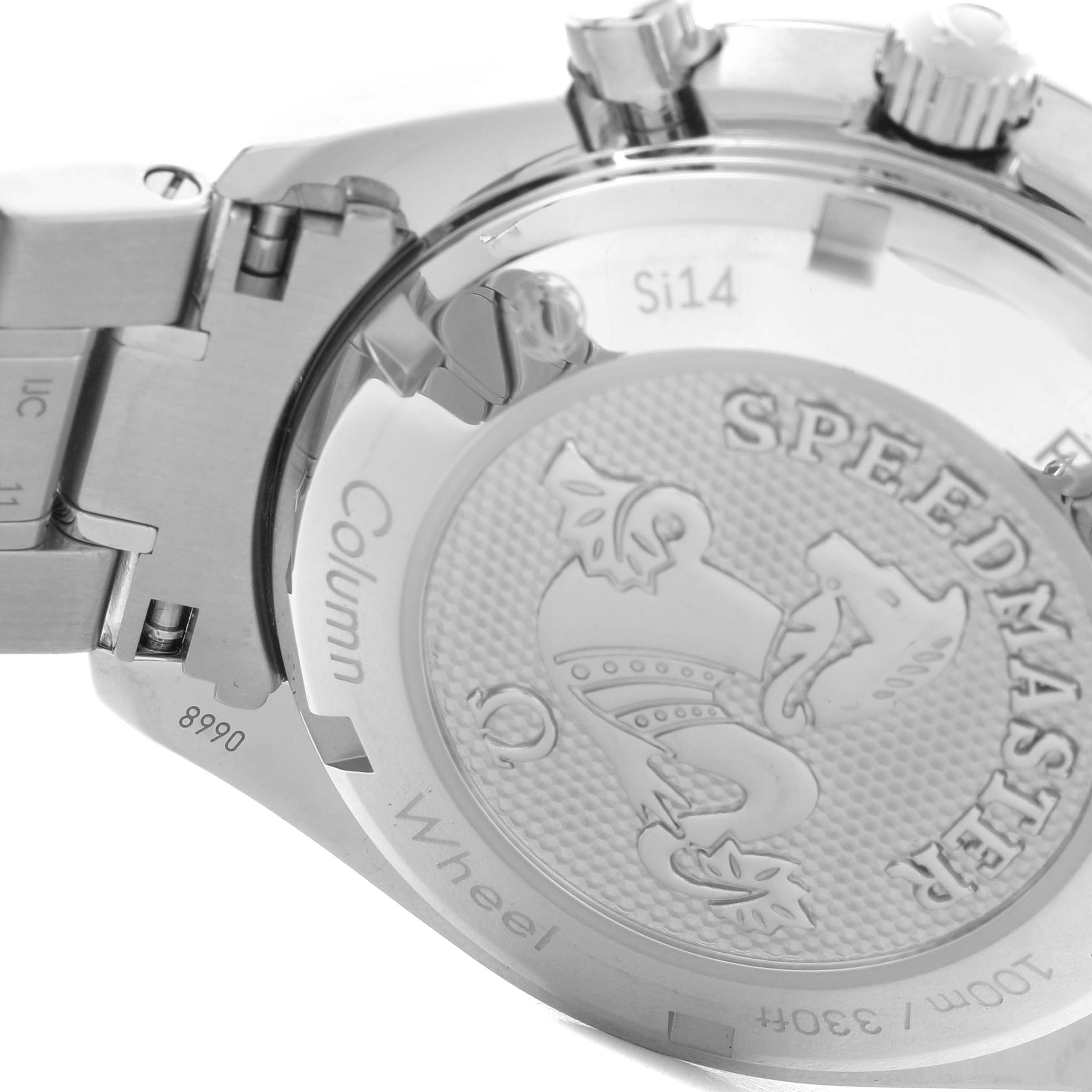 The image shows the case back of an Omega Speedmaster 326.30.40.50.01.002 Men's Stainless Steel Black Dial 326.30.40.50.01.002 Men's Stainless Steel Black Dial, highlighting the engraved emblem and text.