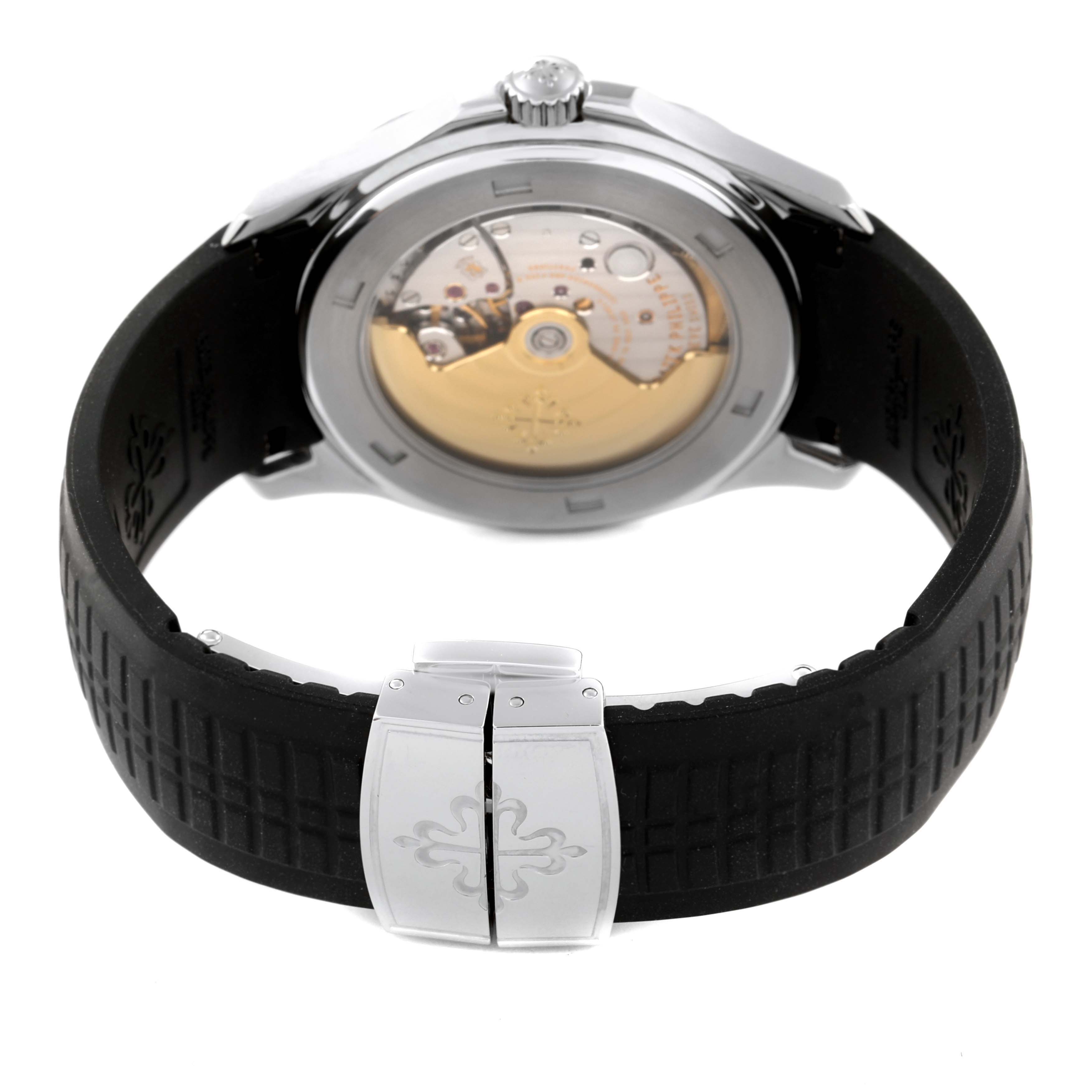 The Patek Philippe Aquanaut 5165A-001 Men's Stainless Steel Black Dial 5165A-001 Men's Stainless Steel Black Dial watch is shown from the back, highlighting the movement and deployment clasp on the rubber strap.