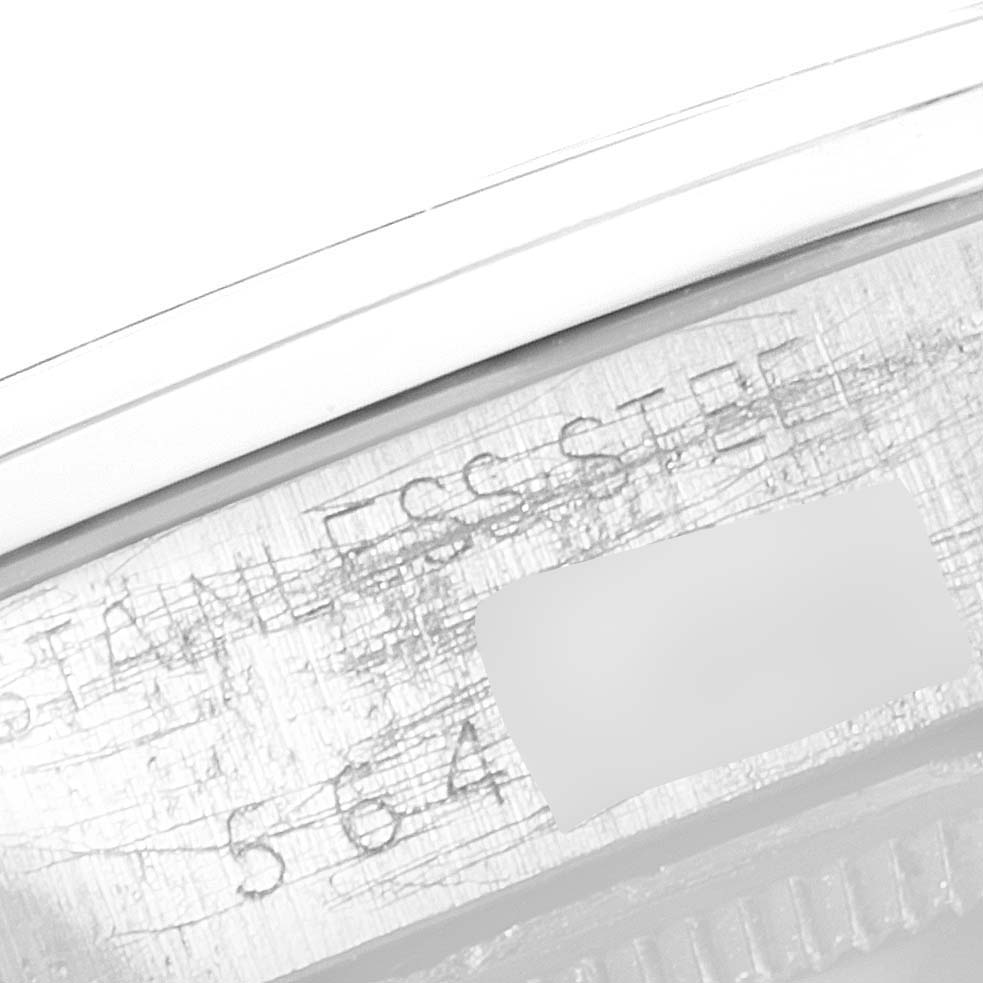 This image shows a close-up angle of the Rolex Air-King 5500 Men's Stainless Steel Silver Dial 5500 Men's Stainless Steel Silver Dial watch's inner bezel with partially visible engraving.