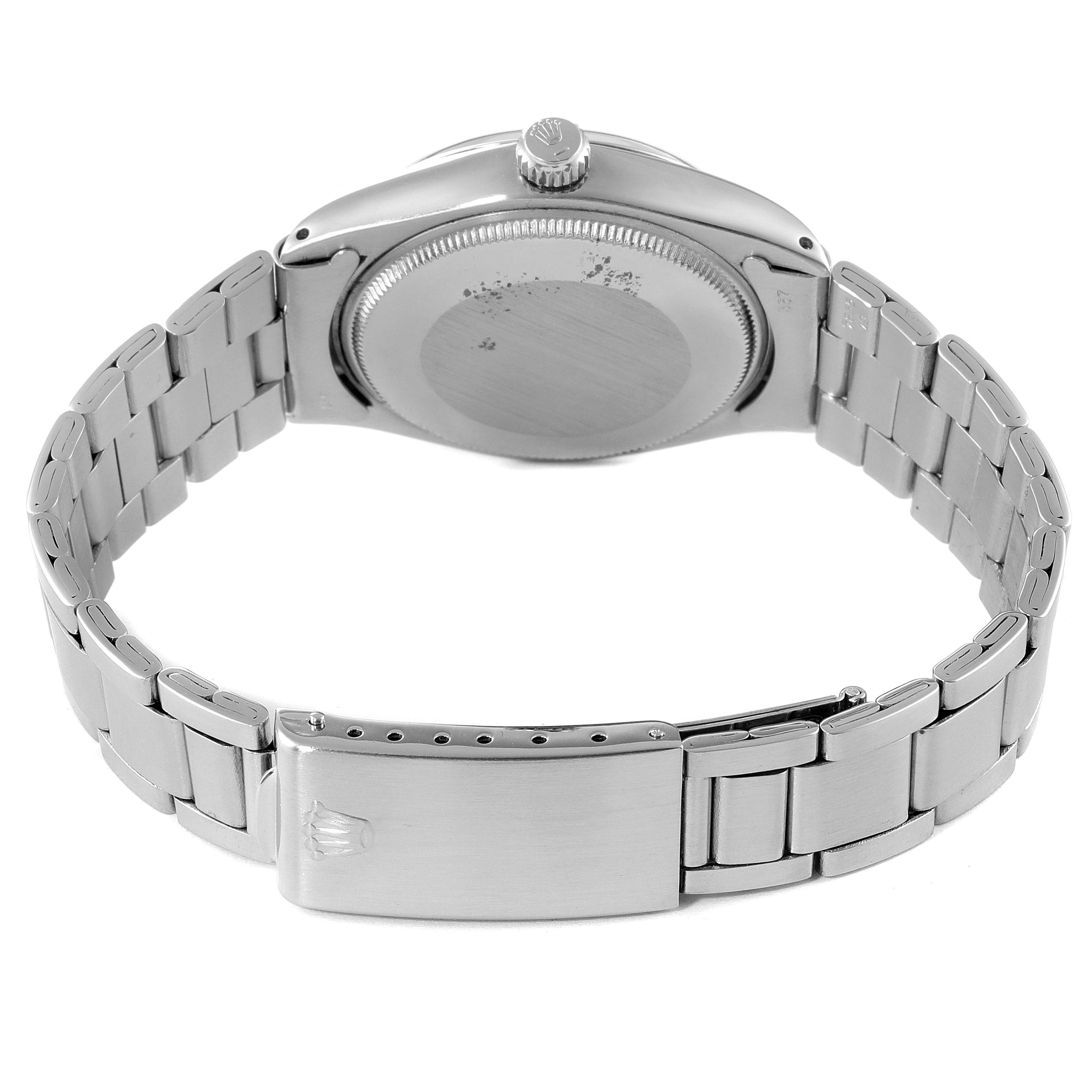 This image shows the back view of a Rolex Air-King 5500 Men's Stainless Steel Silver Dial 5500 Men's Stainless Steel Silver Dial watch, highlighting the case back, crown, and bracelet with the clasp.