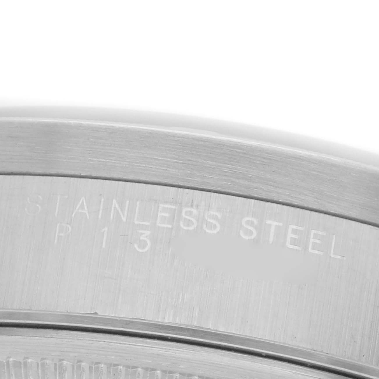 The image shows a close-up of the case back edge with engraving on a Rolex Date 15210 Men
s Stainless Steel Blue Dial 15210 Men
s Stainless Steel Blue Dial model watch.