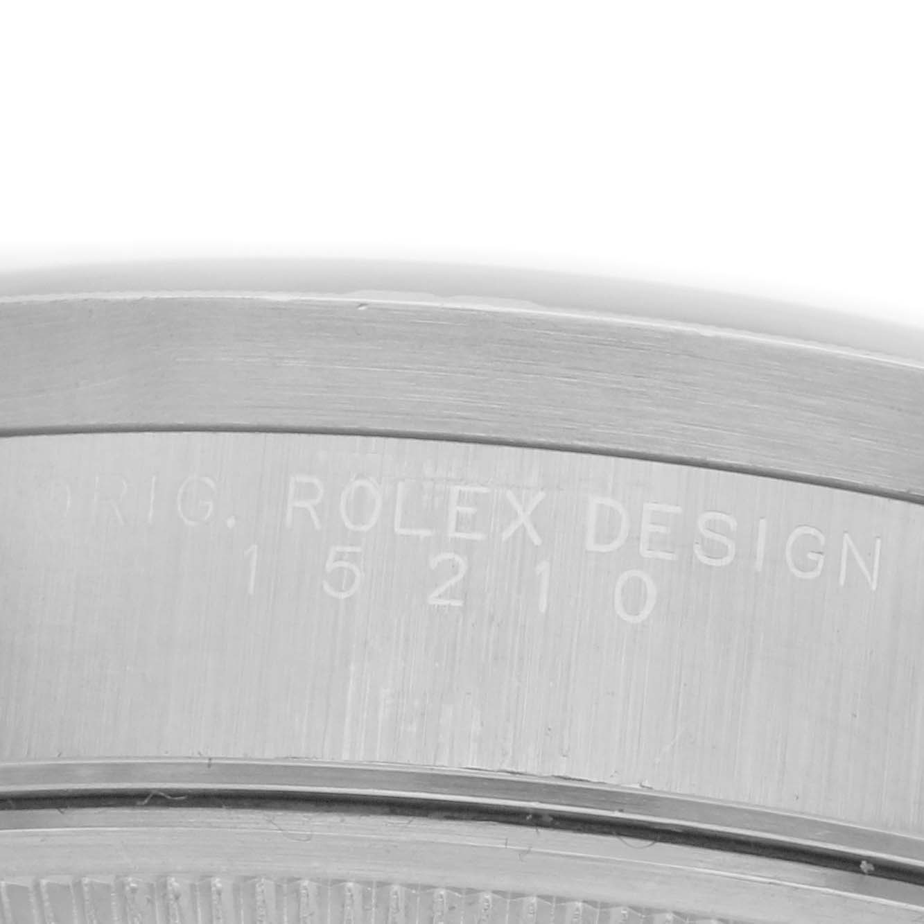 The image shows a close-up of the side of a Rolex Date 15210 Men
s Stainless Steel Blue Dial 15210 Men
s Stainless Steel Blue Dial model watch, highlighting the engraved model number.