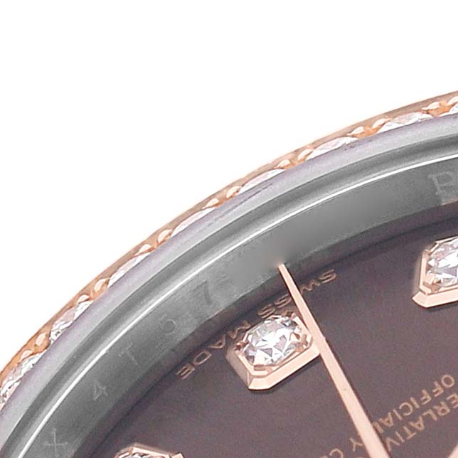 The image shows a close-up of the Rolex Datejust 279381 Women's Steel and Gold (two tone) Brown Dial watch's dial with diamond hour markers and part of the bezel.