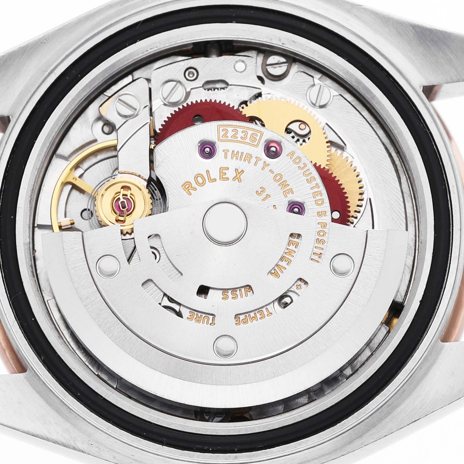 The image shows the inner mechanism of the Rolex Datejust 279381 Women's Steel and Gold (two tone) Brown Dial, featuring gears and the rotor from a top-down view.