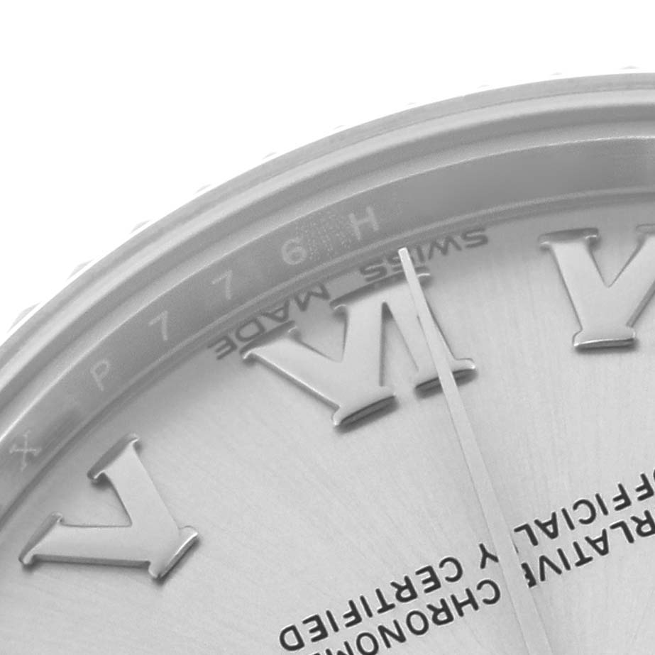 The image shows a close-up of the Rolex Datejust dial, focusing on the Roman numerals and the "Swiss Made" text.