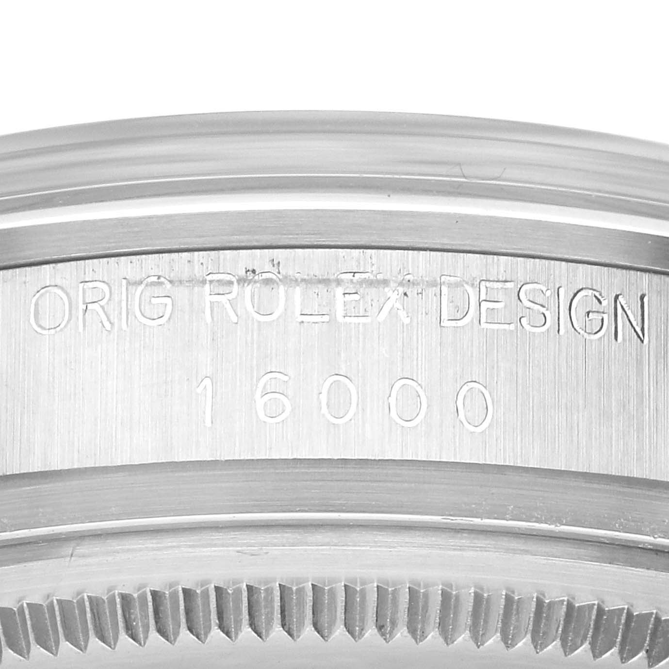 The image shows a close-up of the bezel and engraving on a Rolex Datejust 16000 Men's Stainless Steel White Dial 16000 Men's Stainless Steel White Dial watch, focusing on the "Orig Rolex Design 16000".