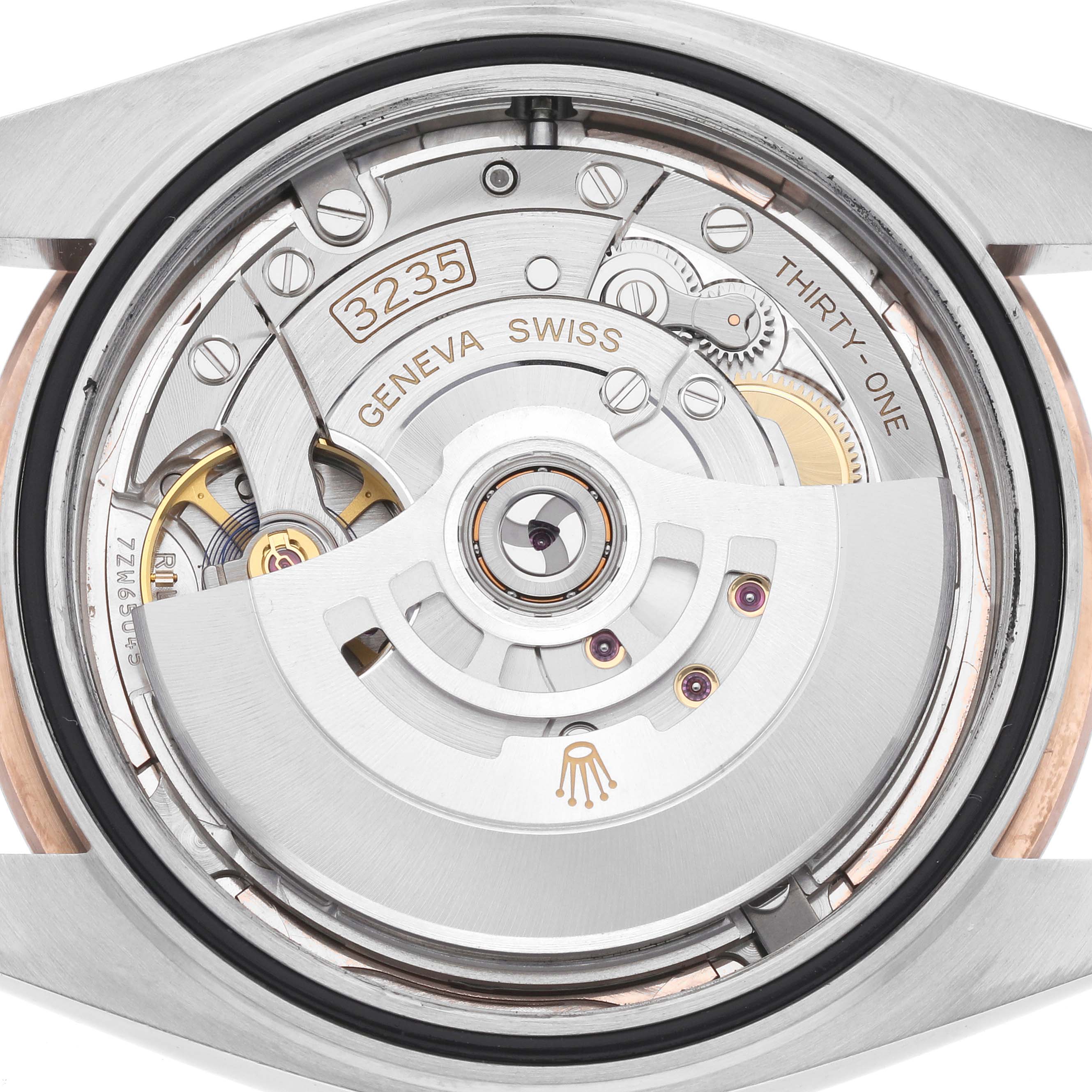 The image shows the movement and rotor of the Rolex Datejust 41 126331 Men
s Steel and Gold (two tone) Pink Dial 126331 Men
s Steel and Gold (two tone) Pink Dial model from the back.
