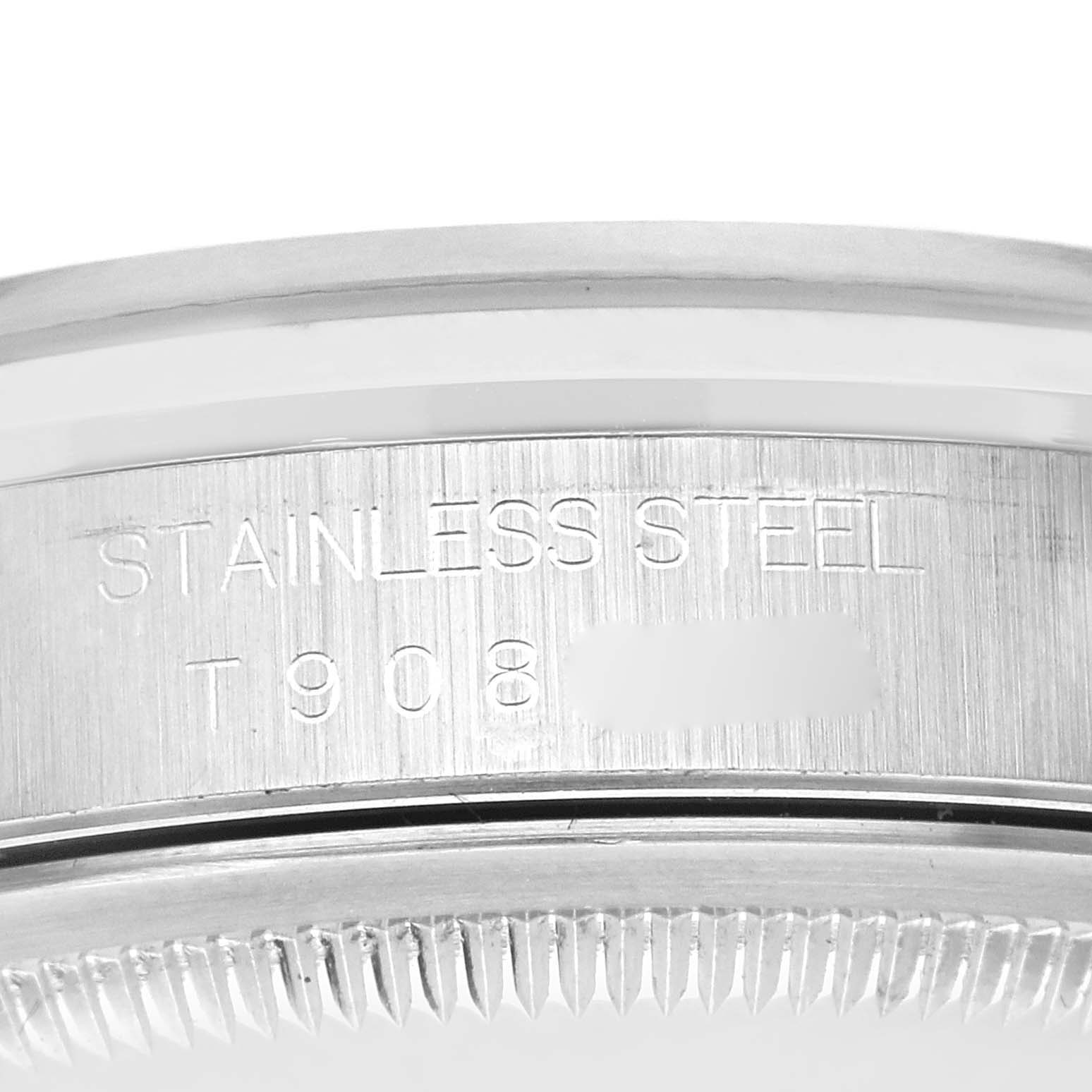 The image shows a close-up of the side and bezel of a Rolex Datejust 16200 Men's Stainless Steel Blue Dial 16200 Men's Stainless Steel Blue Dial watch, focusing on the engraved text.