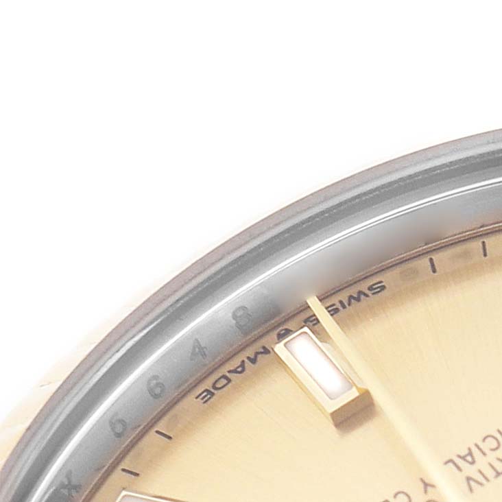The image shows a close-up of the Rolex Mid-Size 178273 Women's Steel and Gold (two tone) Champagne Dial watch face, focusing on the dial, hour markers, and hand.